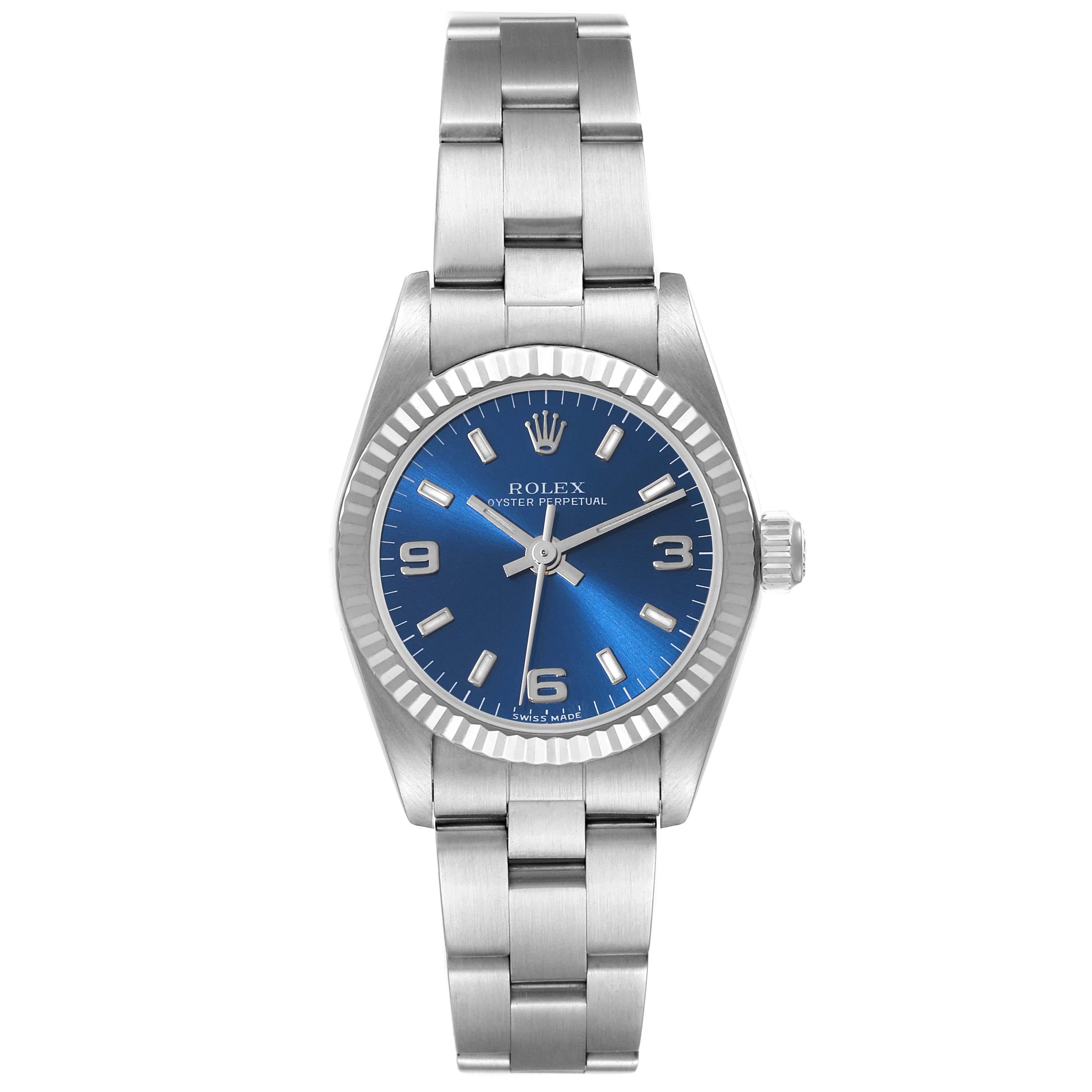 Rolex Oyster Perpetual Blue Dial Steel White Gold Ladies Watch 76094. Officially certified chronometer automatic self-winding movement. Stainless steel oyster case 24.0 mm in diameter. Rolex logo on the crown. 18k white gold fluted bezel. Scratch