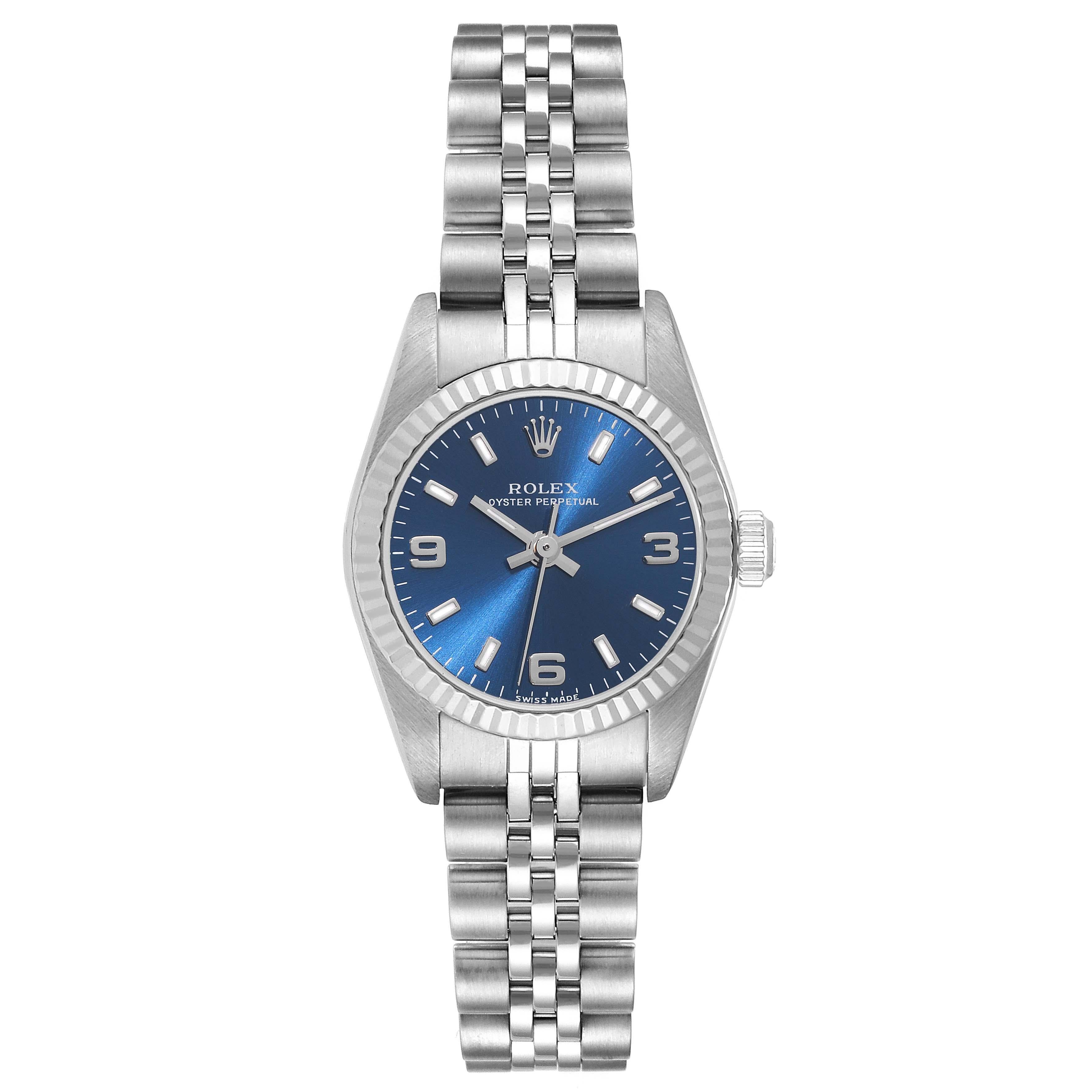 Rolex Oyster Perpetual Blue Dial Steel White Gold Ladies Watch 76094. Officially certified chronometer automatic self-winding movement. Stainless steel oyster case 24.0 mm in diameter. Rolex logo on a crown. 18k white gold fluted bezel. Scratch