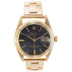 Vintage Rolex Oyster Perpetual Date 18 Karat Gold Ref 1500 Rare Black Dial from 1964