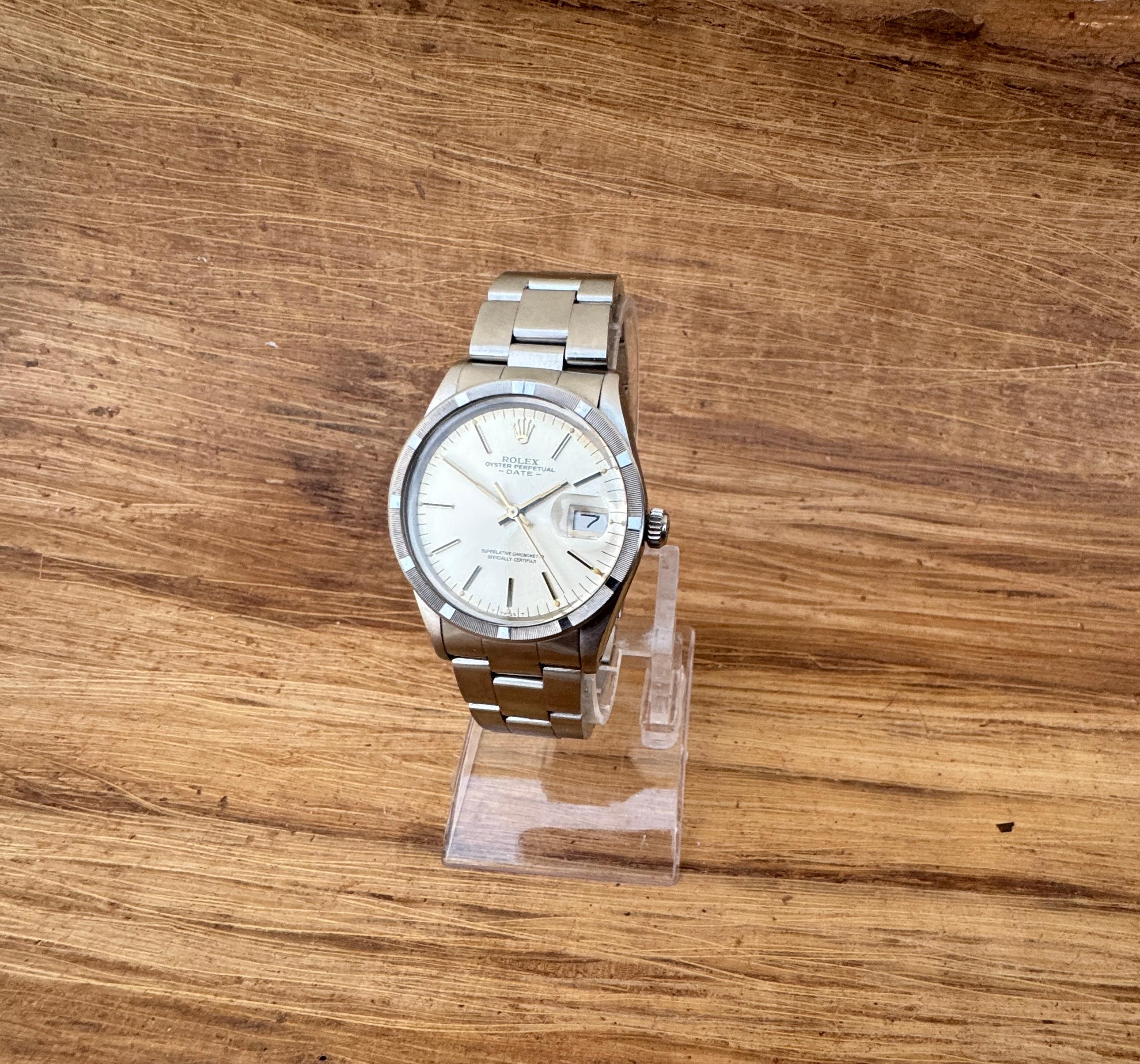 Brand : Rolex

Model: Oyster Perpetual Date

Reference Number: 15010

Country Of Manufacture: Switzerland

Movement: Automatic

Case Material: Steel

Measurements :34mm diameter (excluding crown )

Band Type : Stainless Steel With Marked
