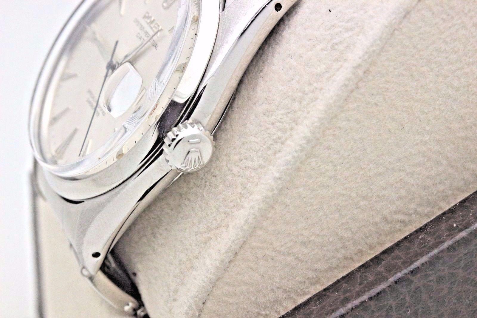 Style Number:  6534

Serial: 2414***

Model: Date

Case Material: Stainless Steel 

Band:  Stainless Steel 

Bezel:  Stainless Steel

Dial:  Silver

Face:  Acrylic

Case Size:  34mm

Includes: 

-Elegant Watch Box

-Certified Appraisal 

-6 Month
