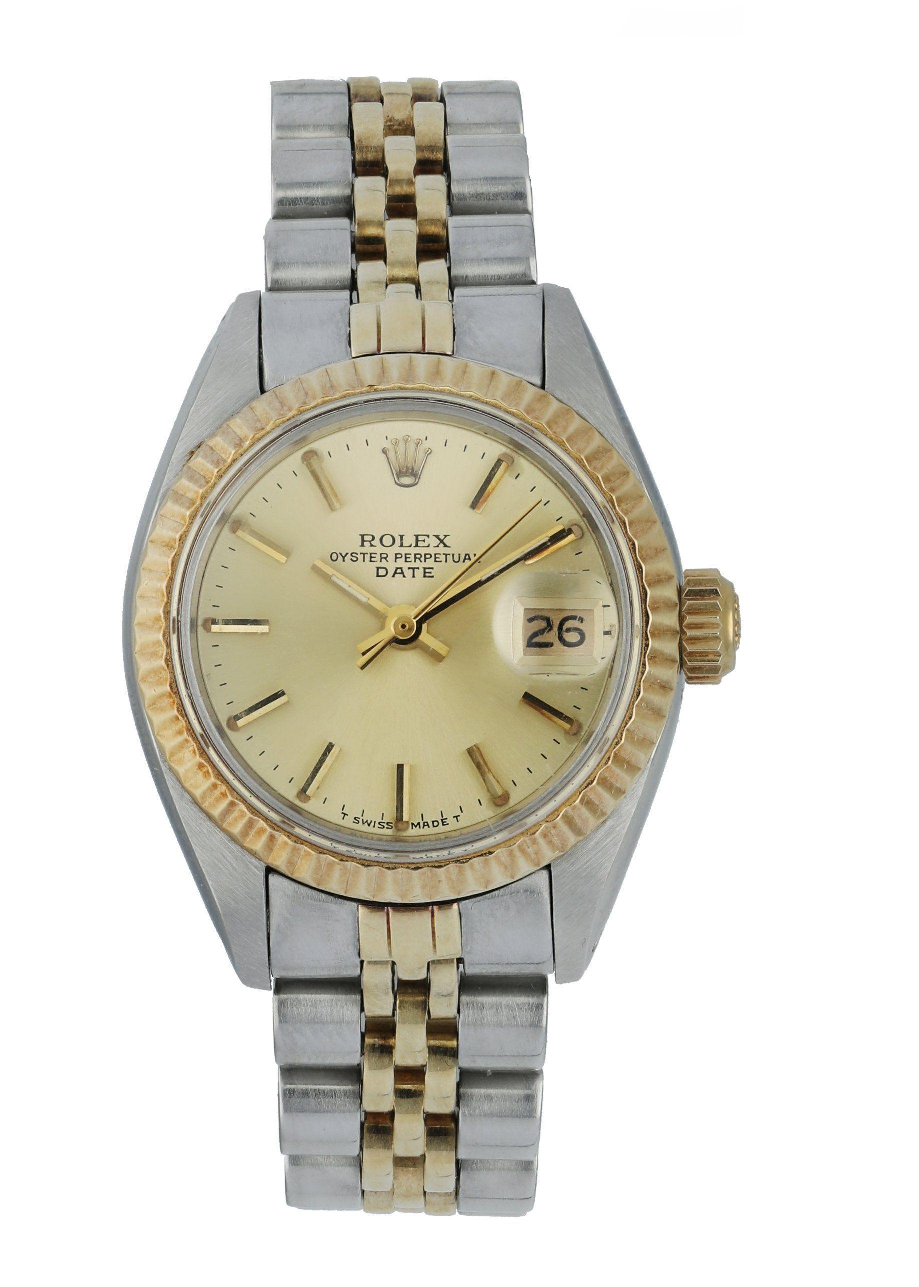 Rolex Oyster Perpetual Date 6917 Ladies Watch
26mm Stainless Steel case. 
Yellow Gold Stationary bezel. 
Off-White dial with gold hands and index hour markers. 
Minute markers on the outer dial. 
Date display at the 3 o'clock position. 
Stainless