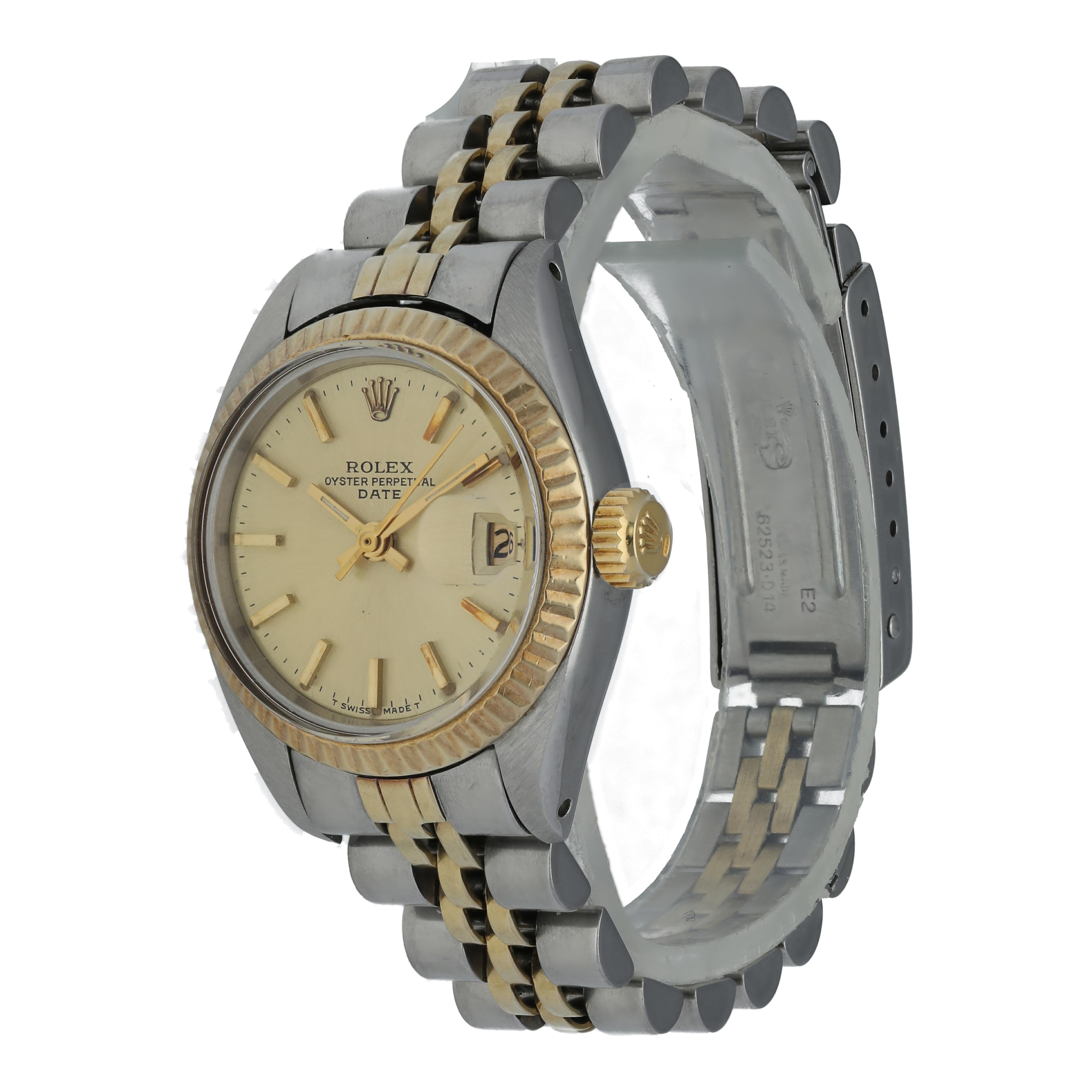 Rolex Oyster Perpetual Date 6917 Ladies Watch
26mm Stainless Steel case. 
Yellow Gold Stationary bezel. 
Off-White dial with gold hands and index hour markers. 
Minute markers on the outer dial. 
Date display at the 3 o'clock position. 
Stainless