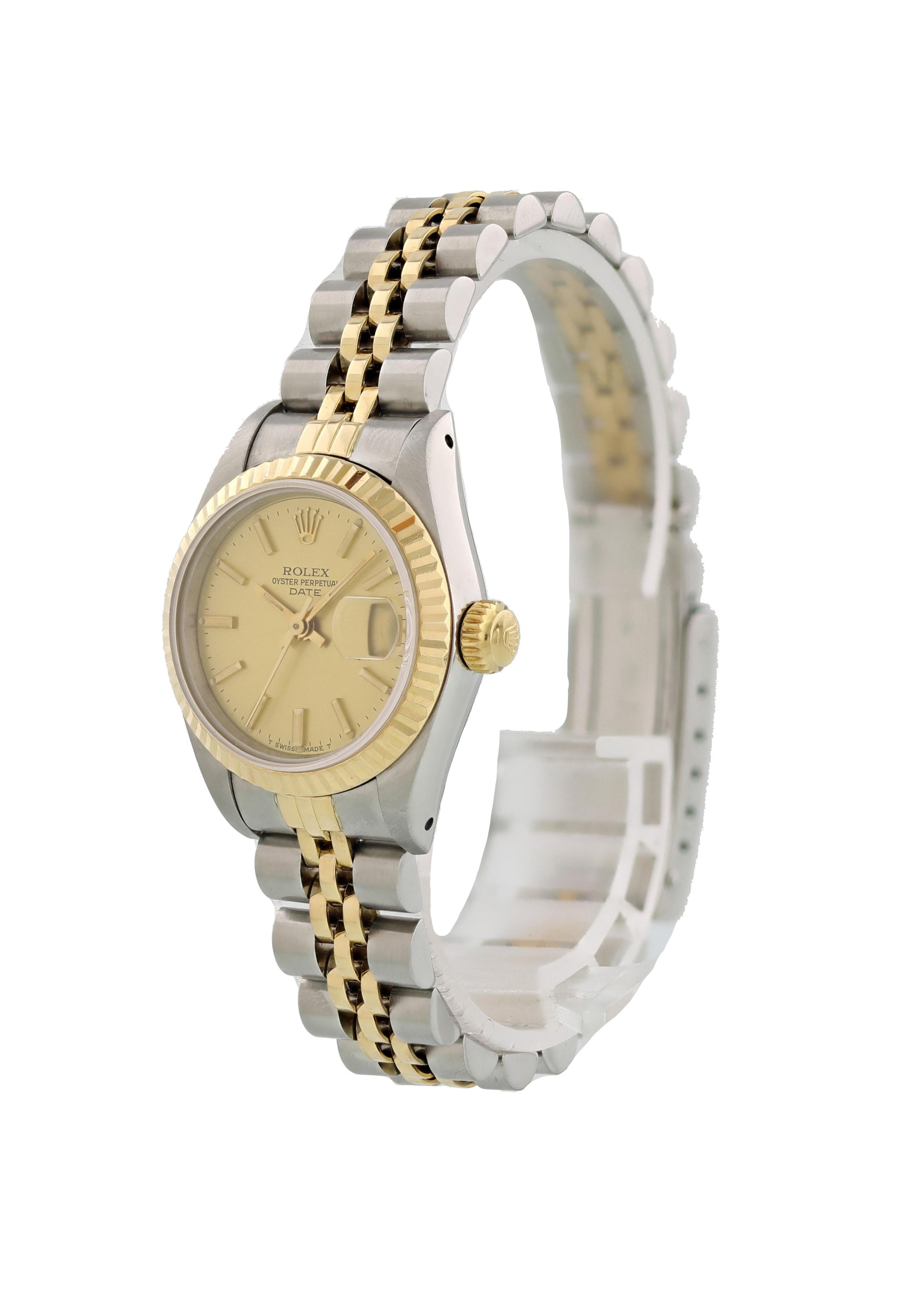Rolex Oyster Perpetual Date 69173 Ladies Watch. 26mm stainless steel case. 18k yellow gold fluted bezel. Champagne dial with gold-tone hands and index hour markers. Minute markers around the outer dial. Quickset date display at the 3 o'clock