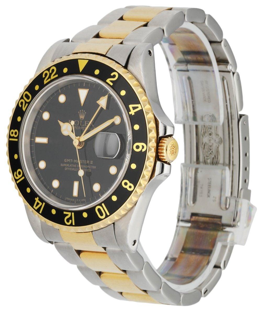 Rolex Oyster Perpetual Date GMT Master ll 16713 Mens Watch. 40mm Stainless Steel case. Bi-directional rotating 18K yellow gold bezel with a black 24-hour bezel insert. Black dial with luminous yellow gold hands and dot hour markers. Minute markers