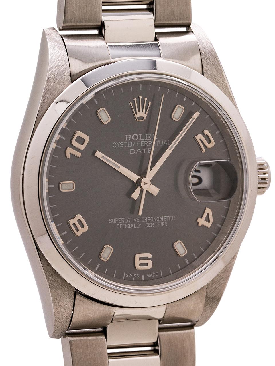 
Rolex Oyster Perpetual Date ref 15200 serial #Y5  circa 2002 with custom colored anthracite gray dial with raised arabic indexes and silver baton hands. Featuring a 34mm diameter case with smooth bezel and sapphire crystal. Very popular dial