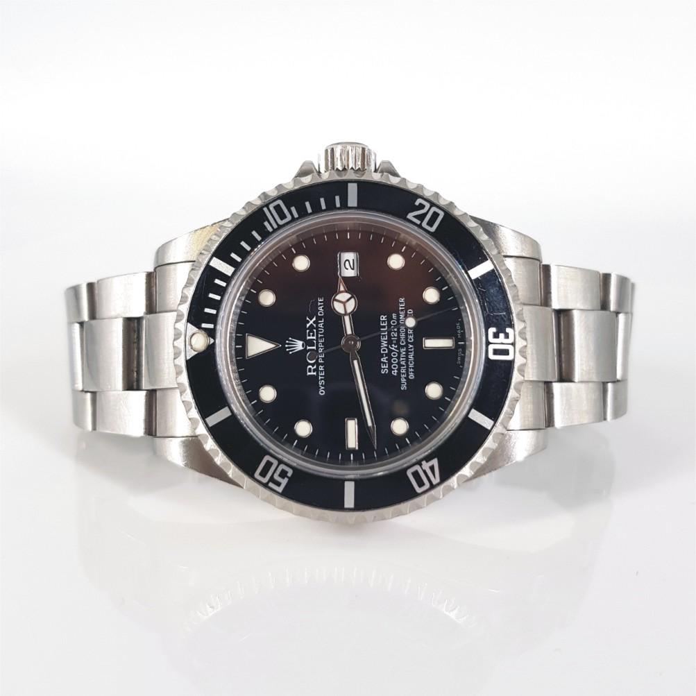 Rolex Oyster Perpetual Date Sea Dweller Watch – Automatic in Excellent condition. 
Model Number: 16600
Year: 1991 - 2010
Stainless Steel Case measuring 40mm with a Black Dial, & Stainless Steel Strap with Box & extra links
