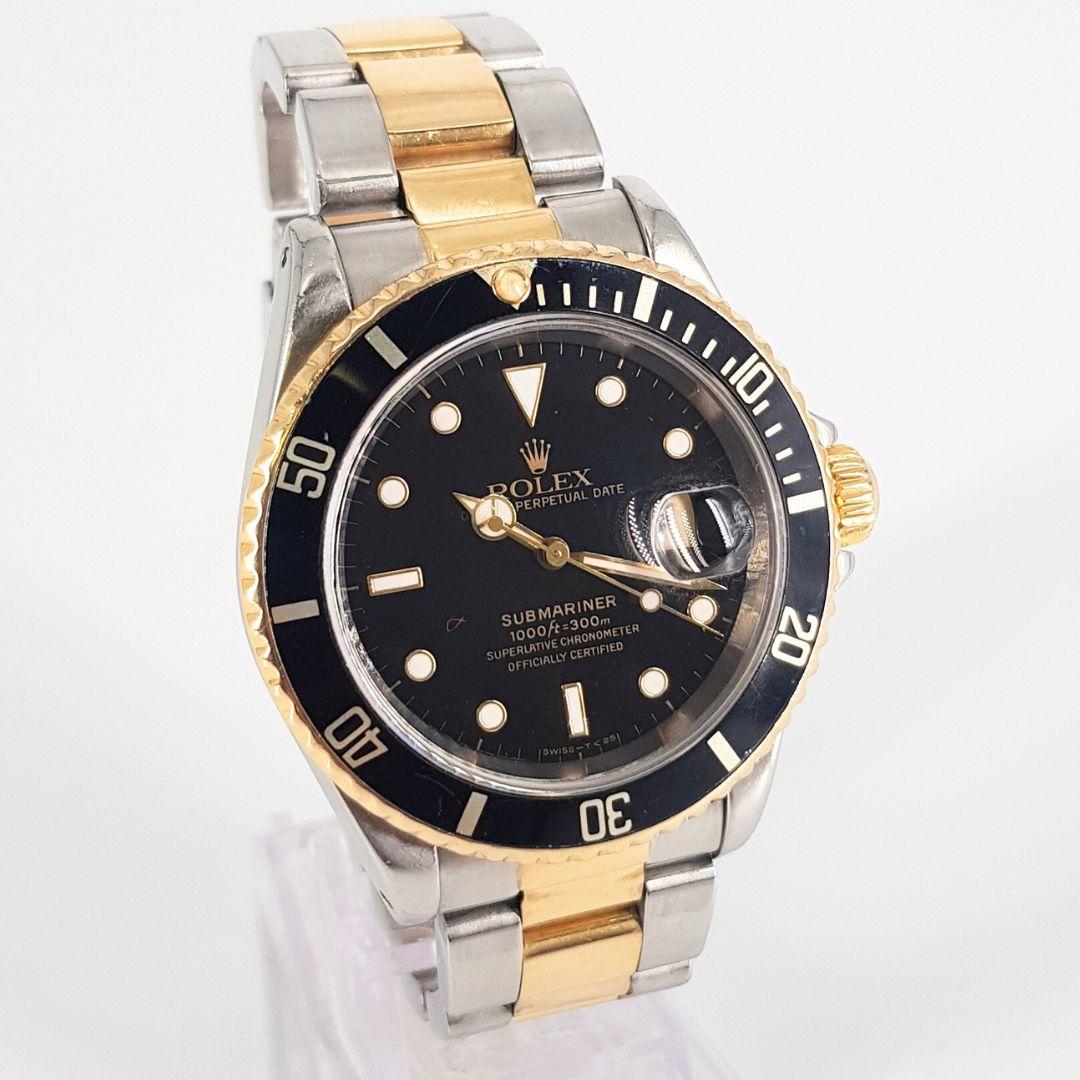 Sturdy
GENDER:  Unisex
MOVEMENT: Automatic
CASE MATERIAL: Sapphire Crystal 
DIAL: 40mm
DIAL COLOUR: Black
STRAP: 50mm
BRACELET MATERIAL: Gold and steel 
CONDITION: 9/10 
MODEL NUMBER:  16613
SERIAL NUMBER: T50355
YEAR: 1996
BOX – Yes
PAPERS – No
