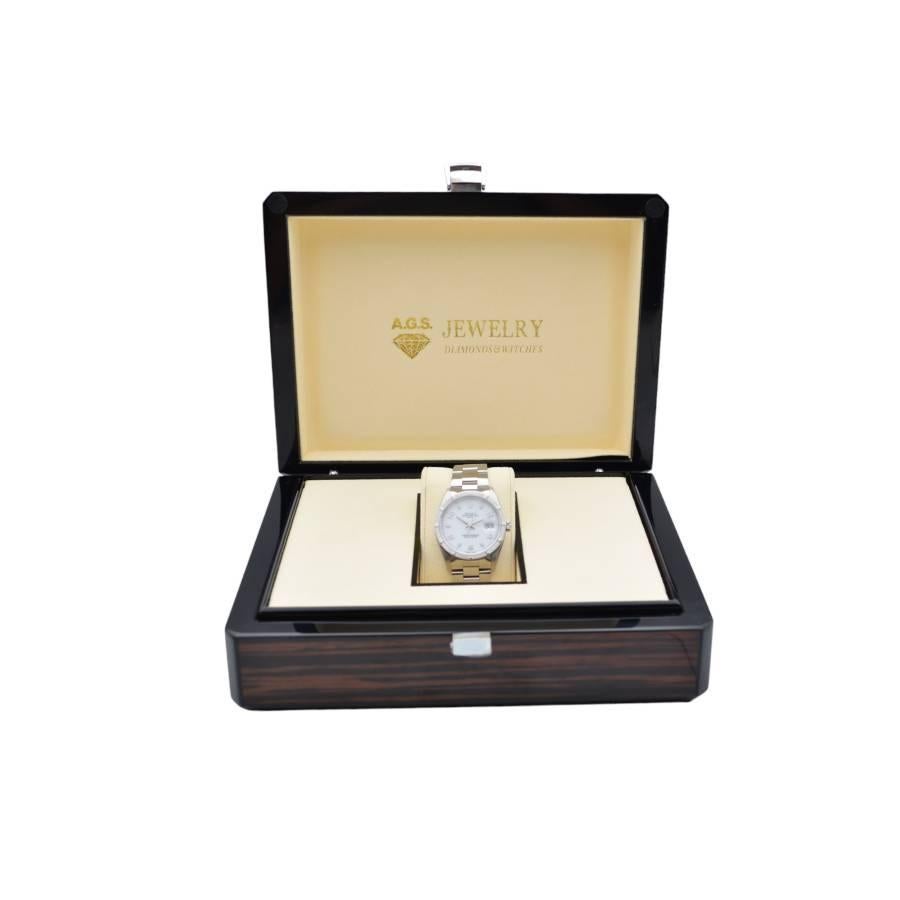 The watch is in a very good condition and it’s working well. The total length of the bracelet (case+bracelet) is 18cm. The watch comes with an AGS Jewelry wooden box, along with an AGS Jewelry warranty card. For more information about delivery,