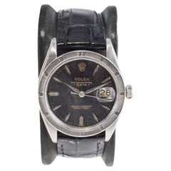 Rolex Oyster Perpetual Date With Rare Engine Turned Bezel and Black Dial 1960's