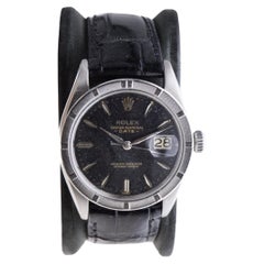 Rolex Oyster Perpetual Date With Rare Engine Turned Bezel and Black Dial 1960's