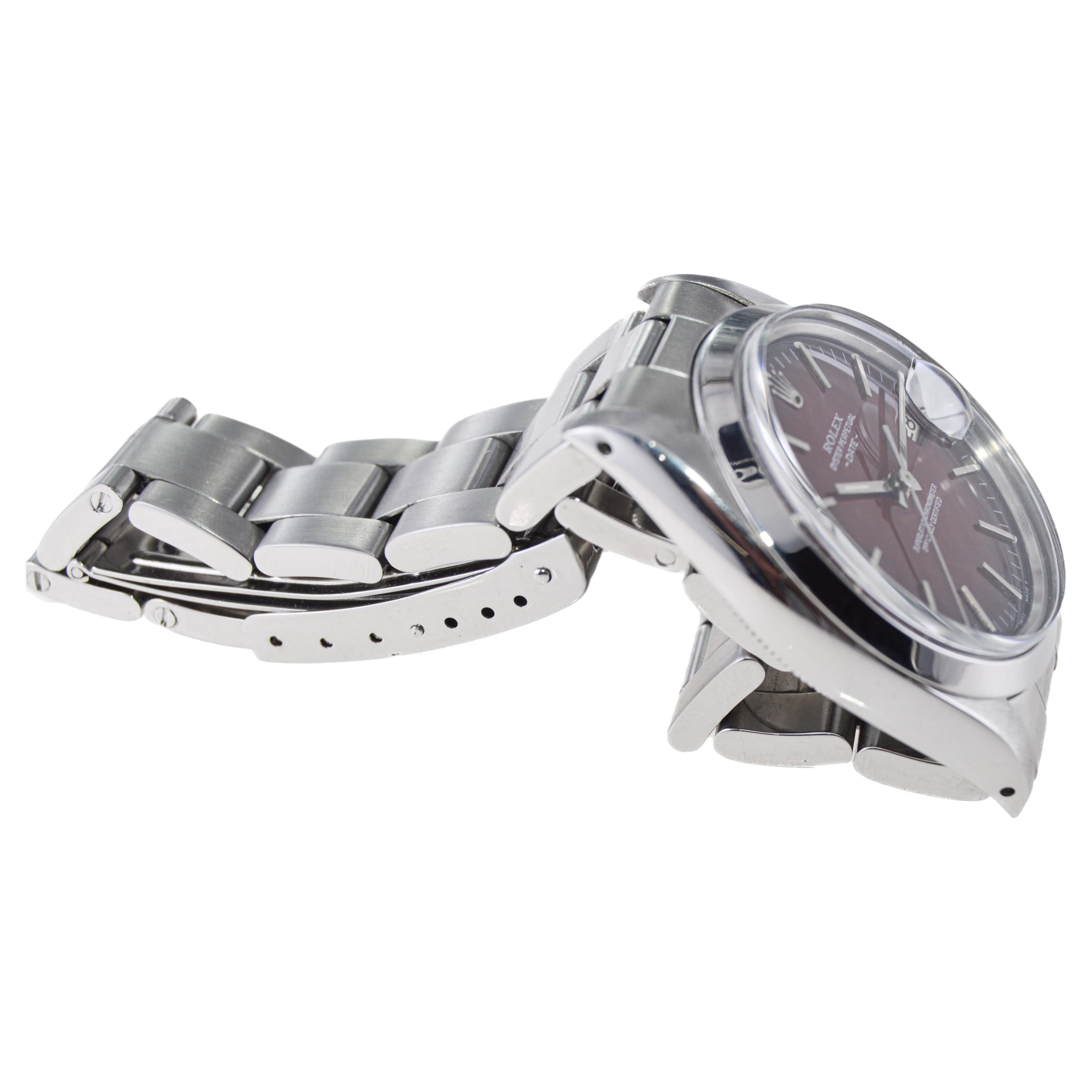 Modern Rolex Oyster Perpetual Date with Rare, Original Shaded Sunburst Red Dial 1970's For Sale