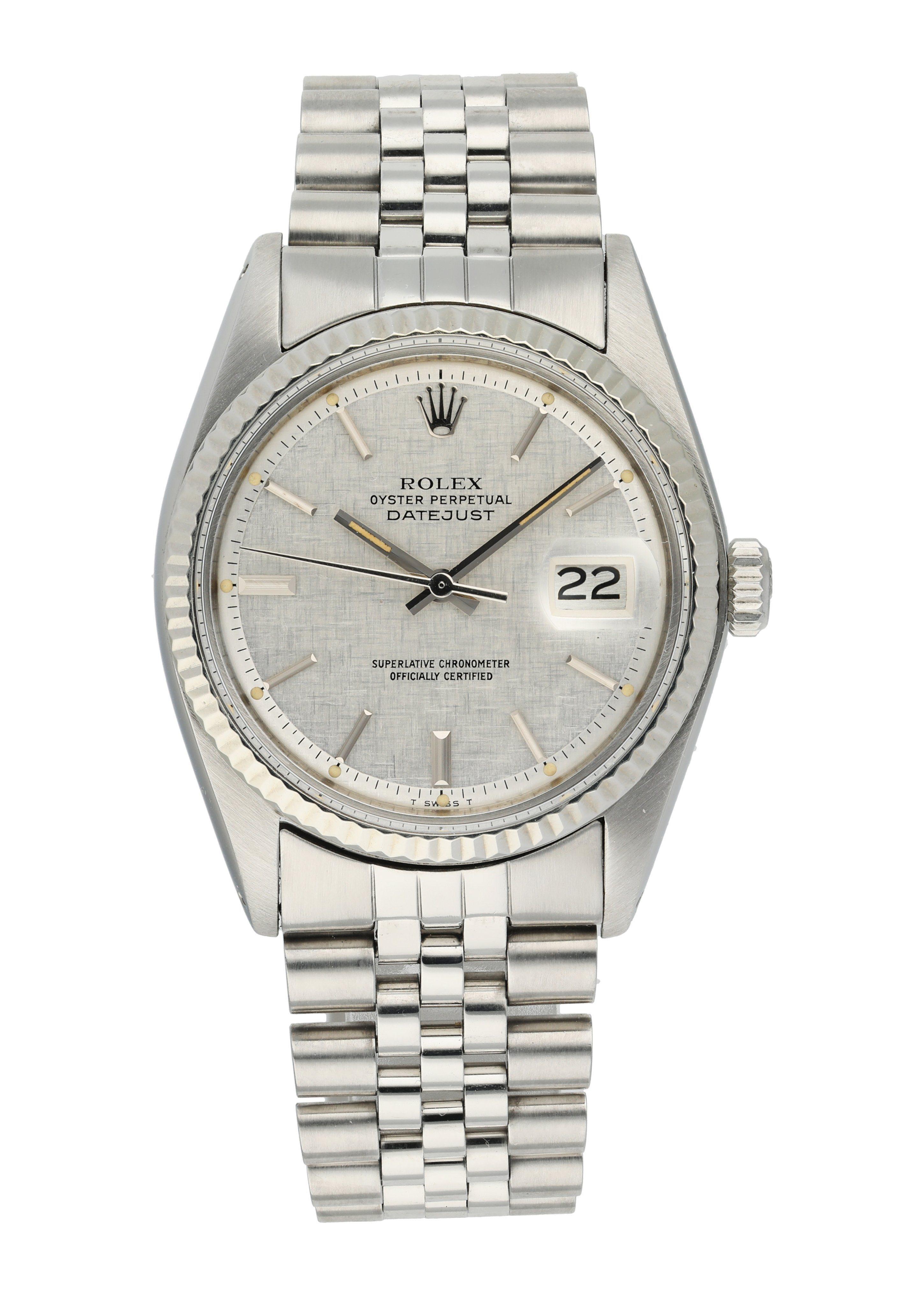 Rolex Oyster Perpetual Datejust 1601 Men's Watch.
36mm Stainless Steel case. 
White Gold fluted bezel. 
Grey linen dial with Luminous Steel hands and index hour markers. 
Minute markers on the outer dial. 
Date display at the 3 o'clock position.