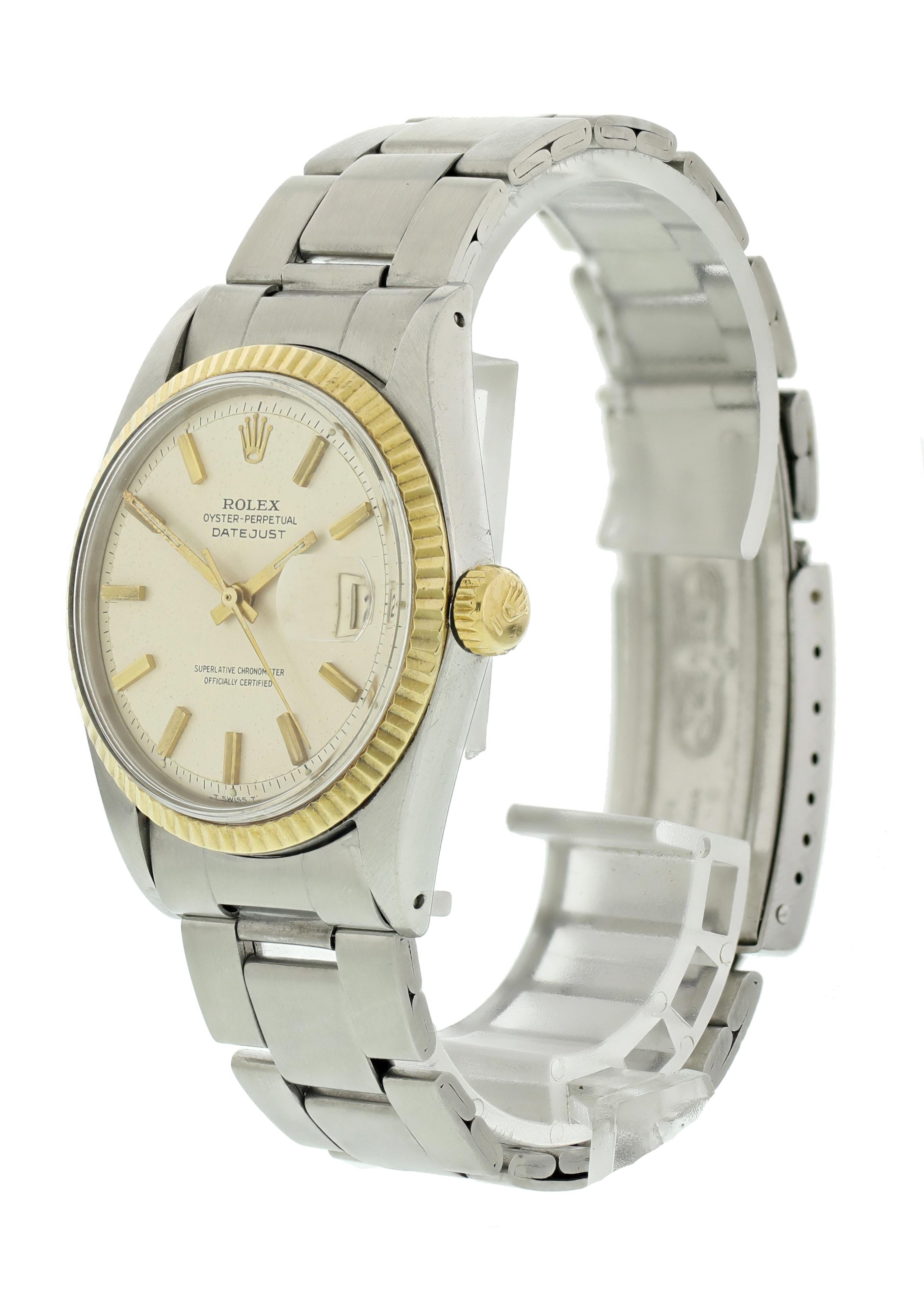 Rolex Oyster Perpetual Datejust 1601 Mens Watch. 36mm Stainless steel case. 18K yellow gold fluted bezel. Pie Pan Silver dial with gold tone hands and hour markers. Minute marker around the outer dial. Date display at the 3 o'clock position.