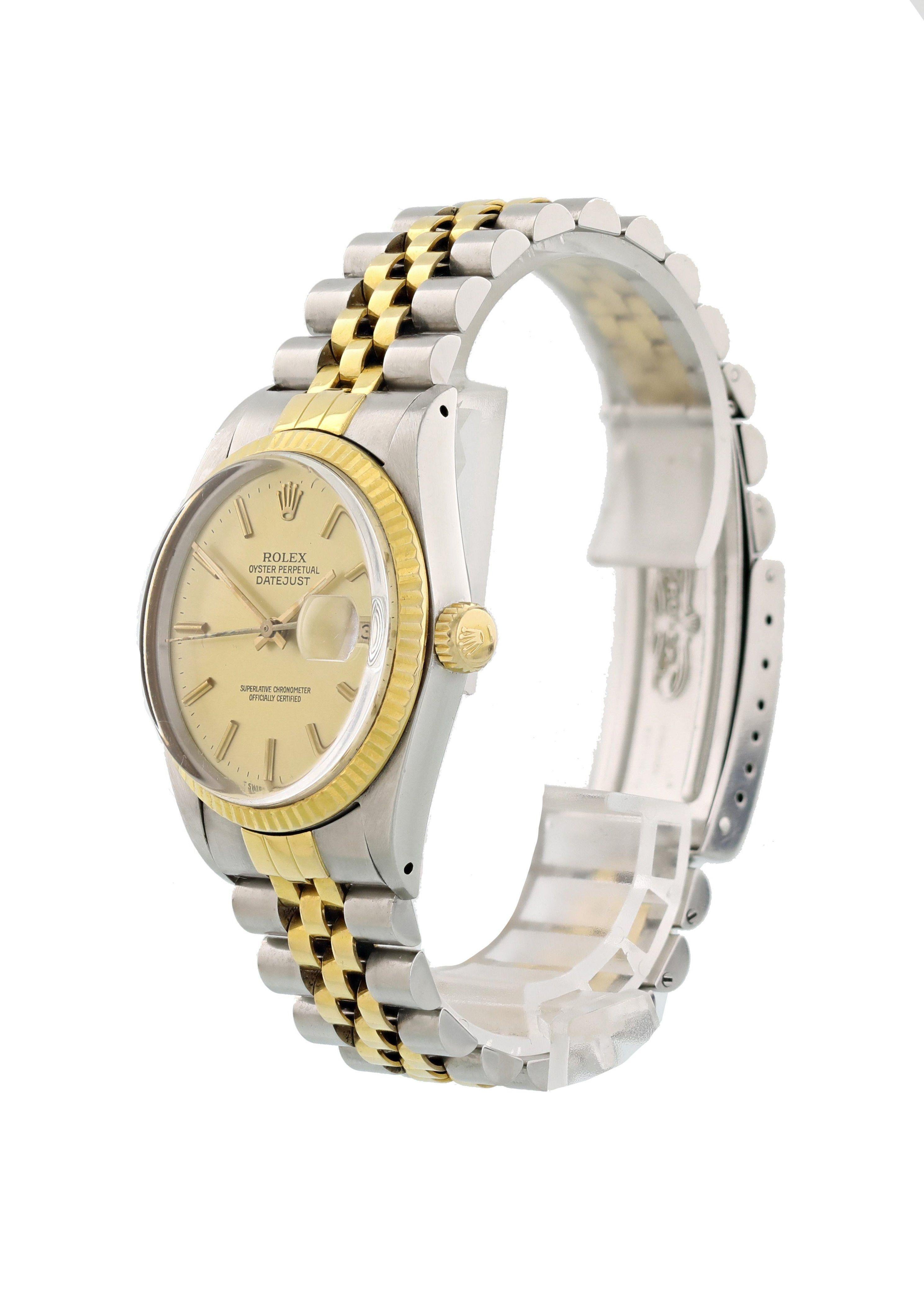 Rolex Oyster Perpetual Datejust 16013 Mens Watch. 
Stainless steel 36mm case. 
18k yellow gold fluted bezel. 
Champagne dial with gold hands and stick index markers. 
Date display at the 3 o'clock position. 
18k yellow gold and stainless steel band