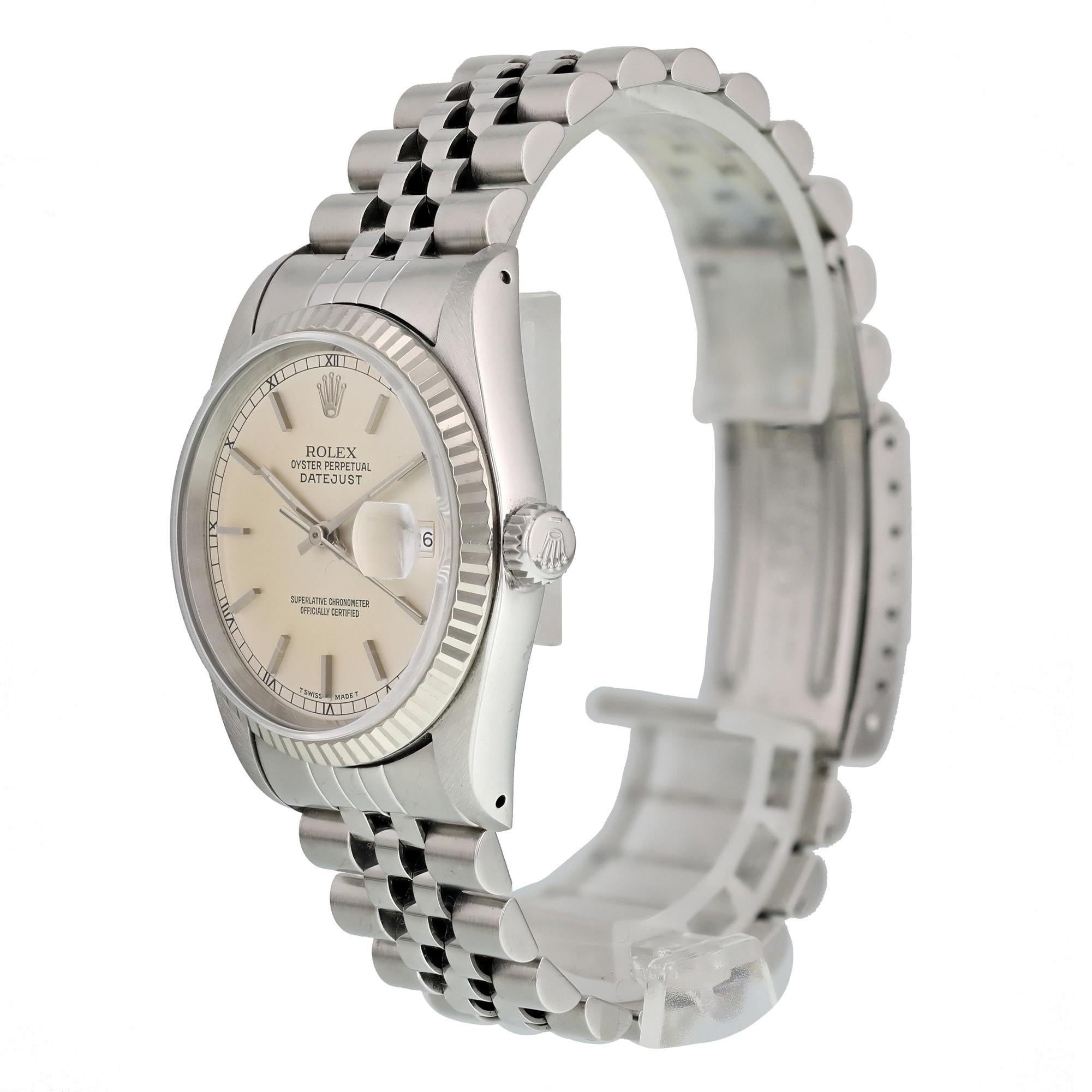 Rolex Oyster Perpetual Datejust 16014 Men's Watch
36mm Stainless Steel case. 
White Gold Stationary bezel. 
Silver dial with Luminous Steel hands and index hour markers. 
Minute markers on the outer dial. 
Date display at the 3 o'clock position.