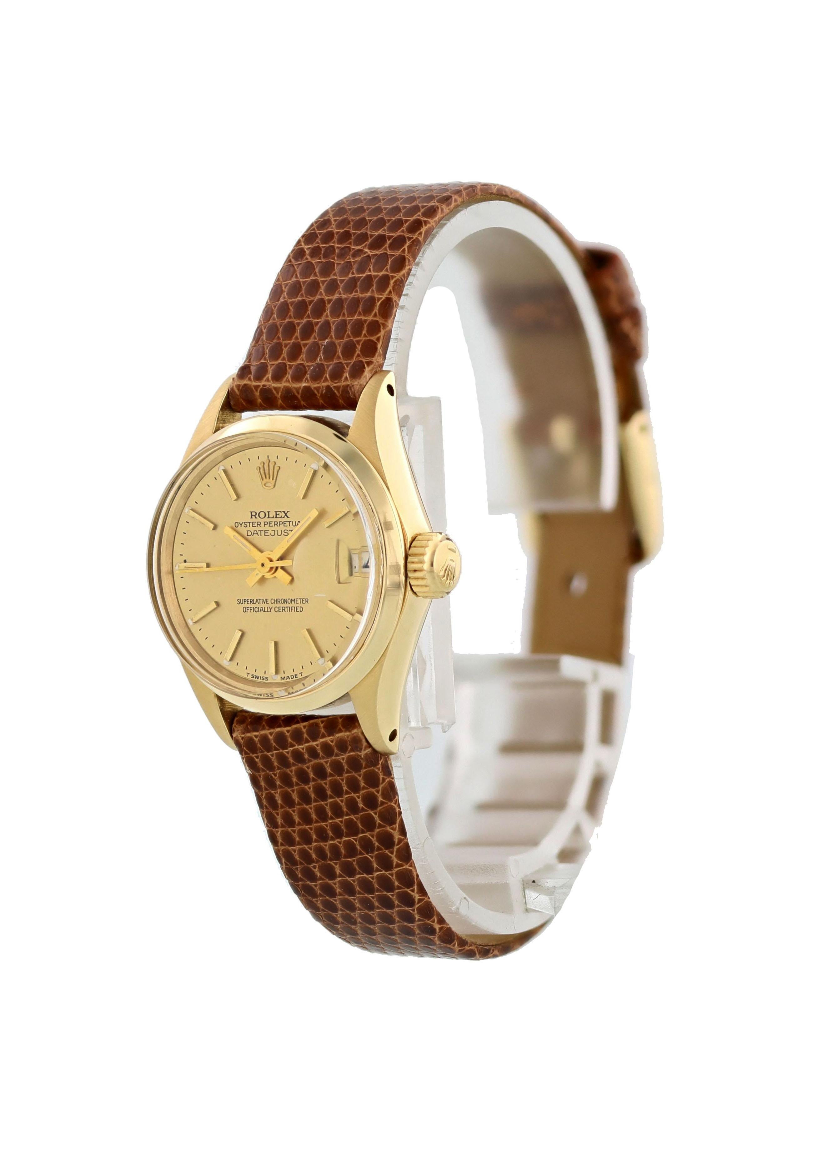 Rolex Oyster Perpetual Date 6516 Ladies Watch. 25 mm stainless steel case. 18k yellow gold smooth bezel. Champagne dial with yellow gold hands and markers. Minute marker on the outer dial. Date display at 3 o'clock position. Brown Lizard Grain Strap