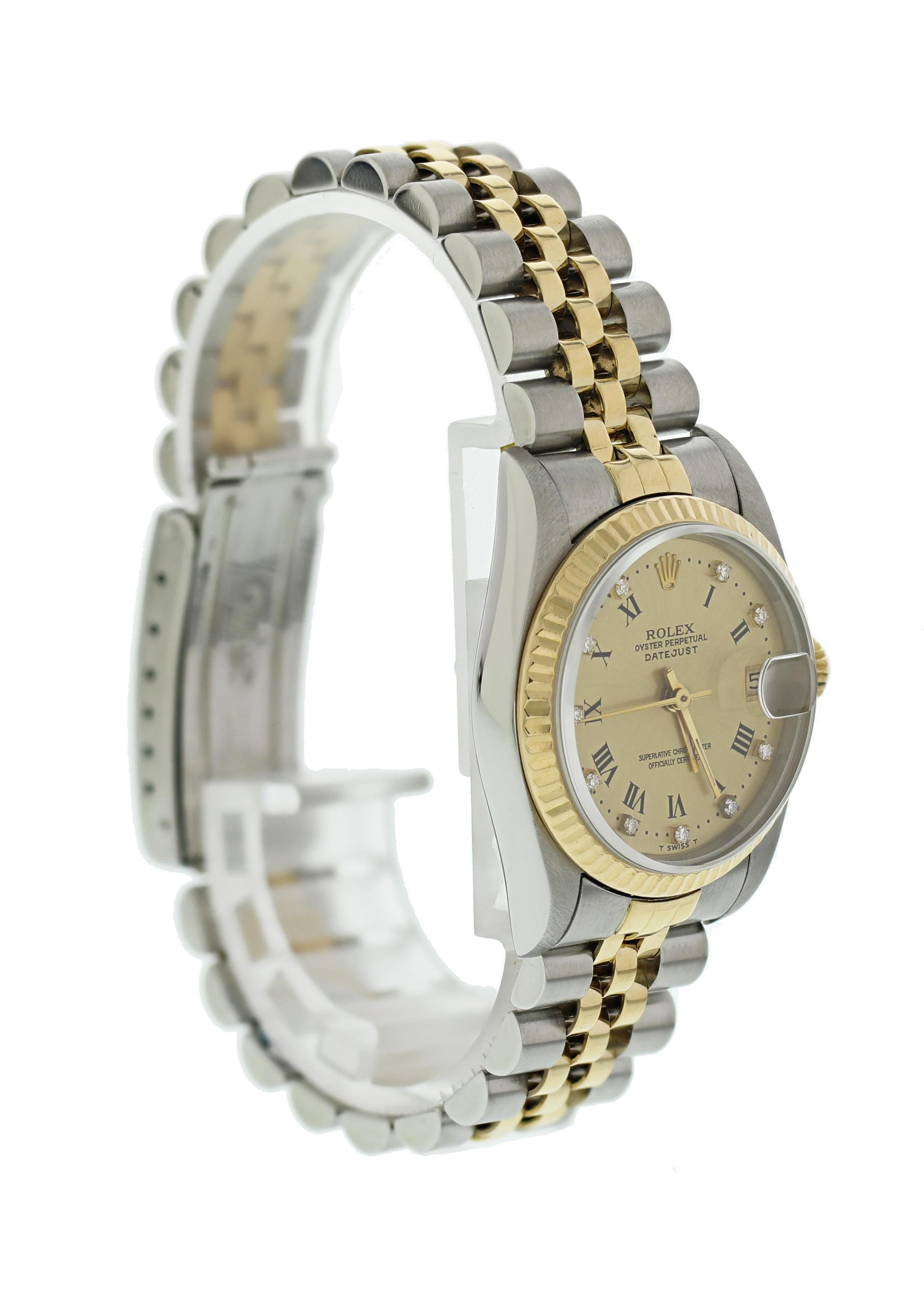 Rolex Oyster Perpetual Midsize Datejust 68273 Ladies Watch. Midsize 31mm stainless steel case. 18k yellow gold Fluted bezel. Champagne dial with factory set diamond hour markers and Black Roman Numeral hour markers. Two-tone stainless steel and 18k