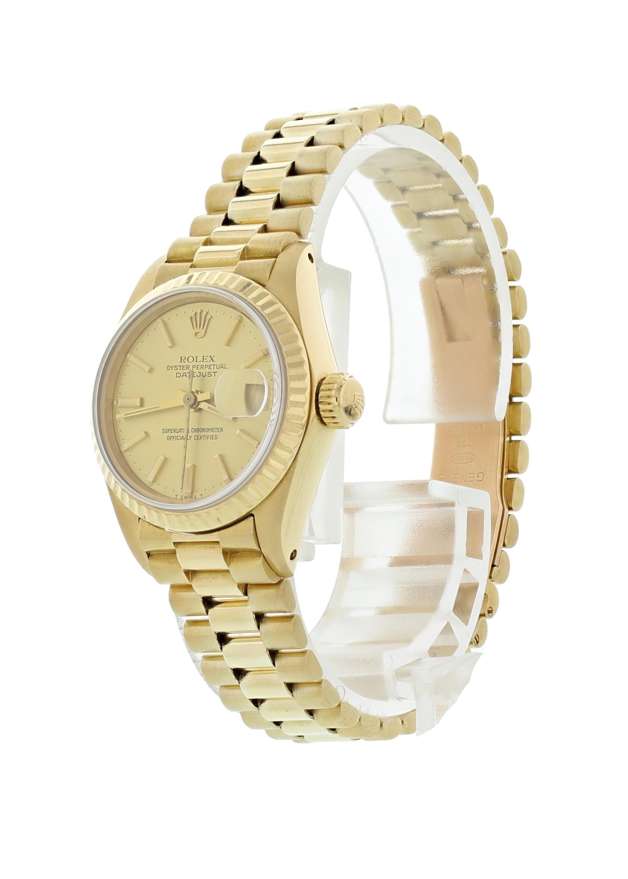 Rolex Oyster Perpetual Datejust 6917 18K Yellow Gold Ladies Watch. 26mm 18k yellow gold case and fluted bezel. Champagne dial with gold hands and indexes. Date aperture. 18K yellow gold Jubilee band with a hidden fold-over clasp. Will fit up to a