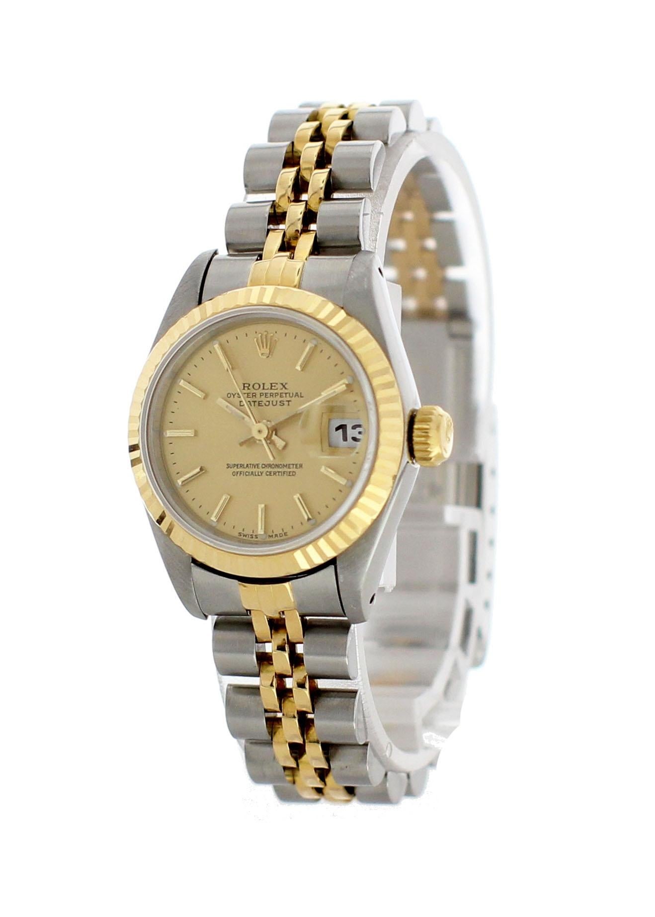 Ladies Rolex Oyster Perpetual Datejust 69173. 26 mm stainless steel case. 18k yellow gold fluted bezel. Champagne dial with yellow gold hands and stick markers. 18k yellow gold and stainless steel Jubilee band with a stainless steel fold-over clasp.