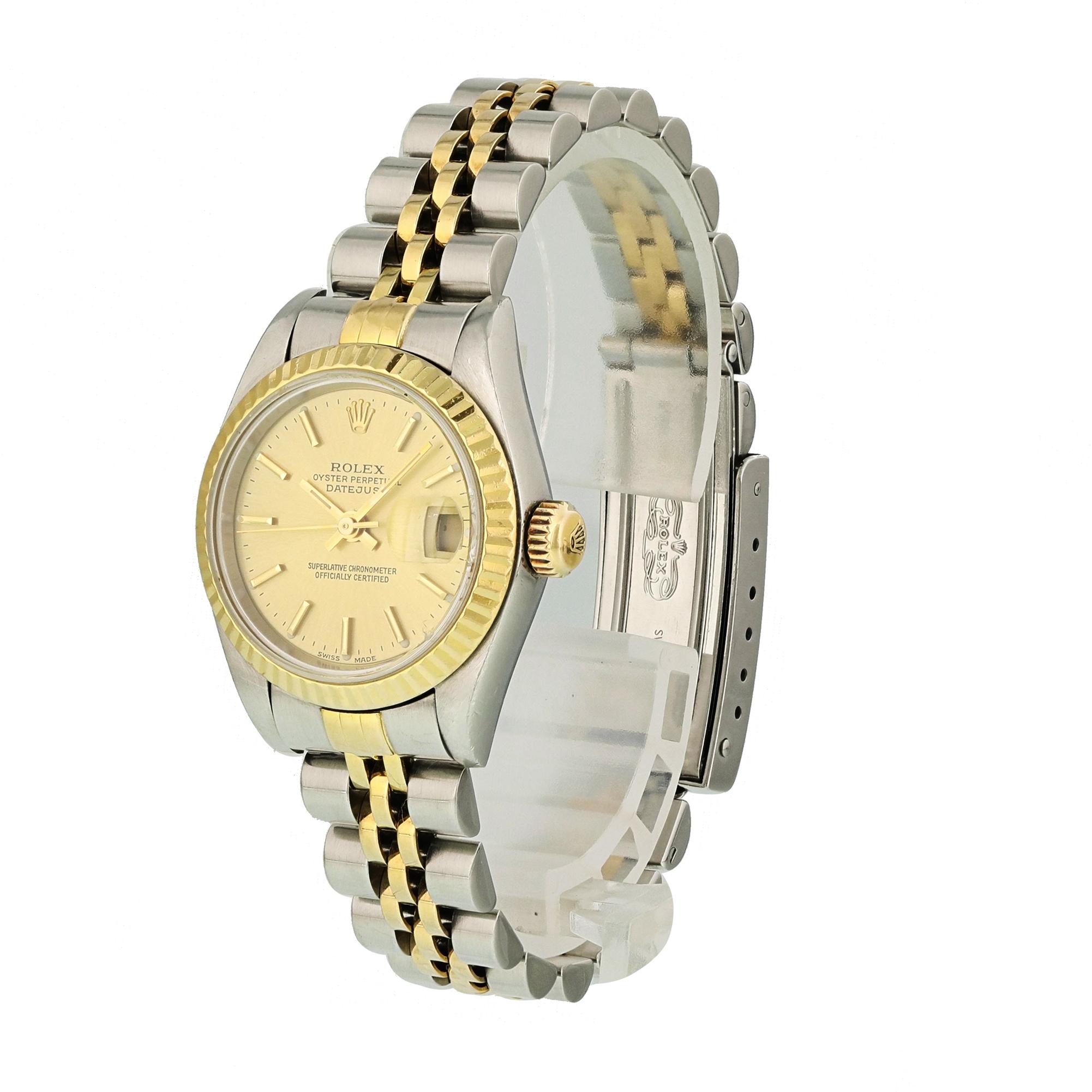 Rolex Oyster Perpetual Datejust 69173 Ladies Watch.
26mm Stainless Steel case. 
Yellow Gold Stationary bezel. 
Champagne dial with luminous gold hands and index hour markers. 
Minute markers on the outer dial. 
Date display at the 3 o'clock