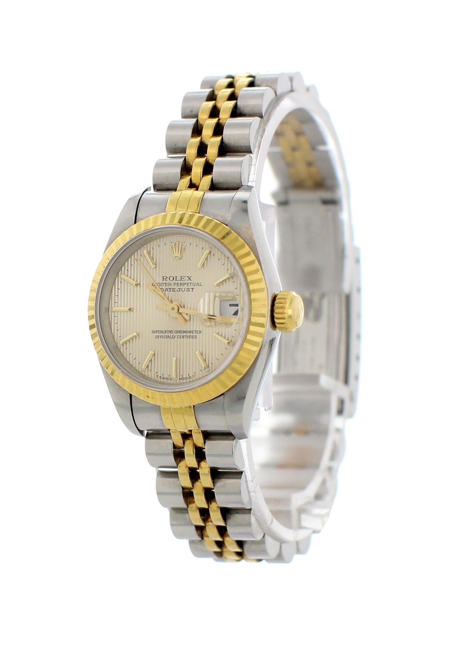 Rolex Oyster Perpetual Datejust Tapestry Dial Ladies Watch. Reference 69173. 26 mm stainless steel case. 18k yellow gold fluted bezel. Cream tapestry dial with yellow gold hands and stick markers. 18k yellow gold and stainless steel Jubilee band