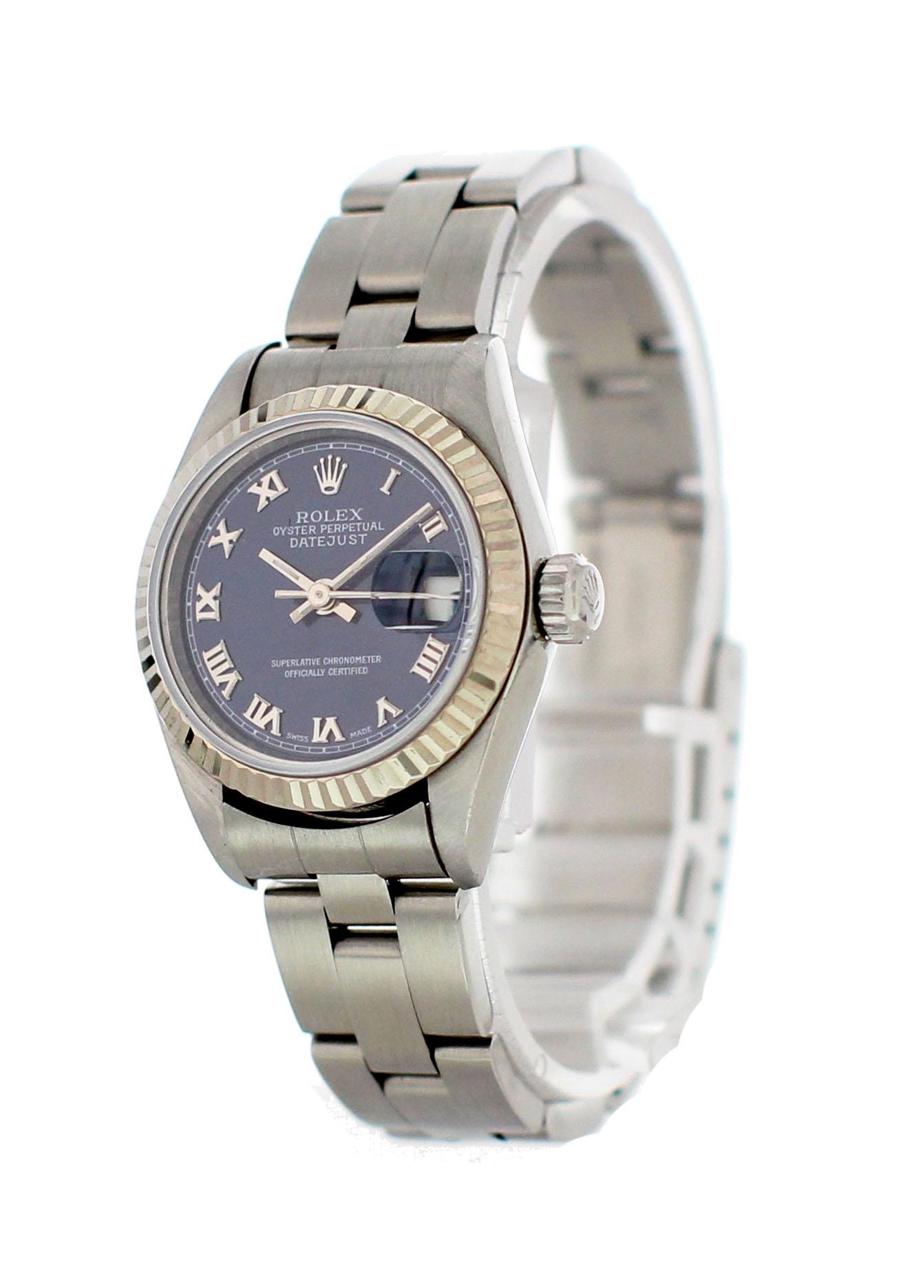 Rolex Oyster Perpetual Datejust 69174 Ladies Watch. 26mm stainless steel case. 18k white gold fluted bezel. Blue dial with steel hands and Roman numeral hands. Date Display by the 3 o'clock. Stainless steel oyster band. Will fit up to a 6-inch