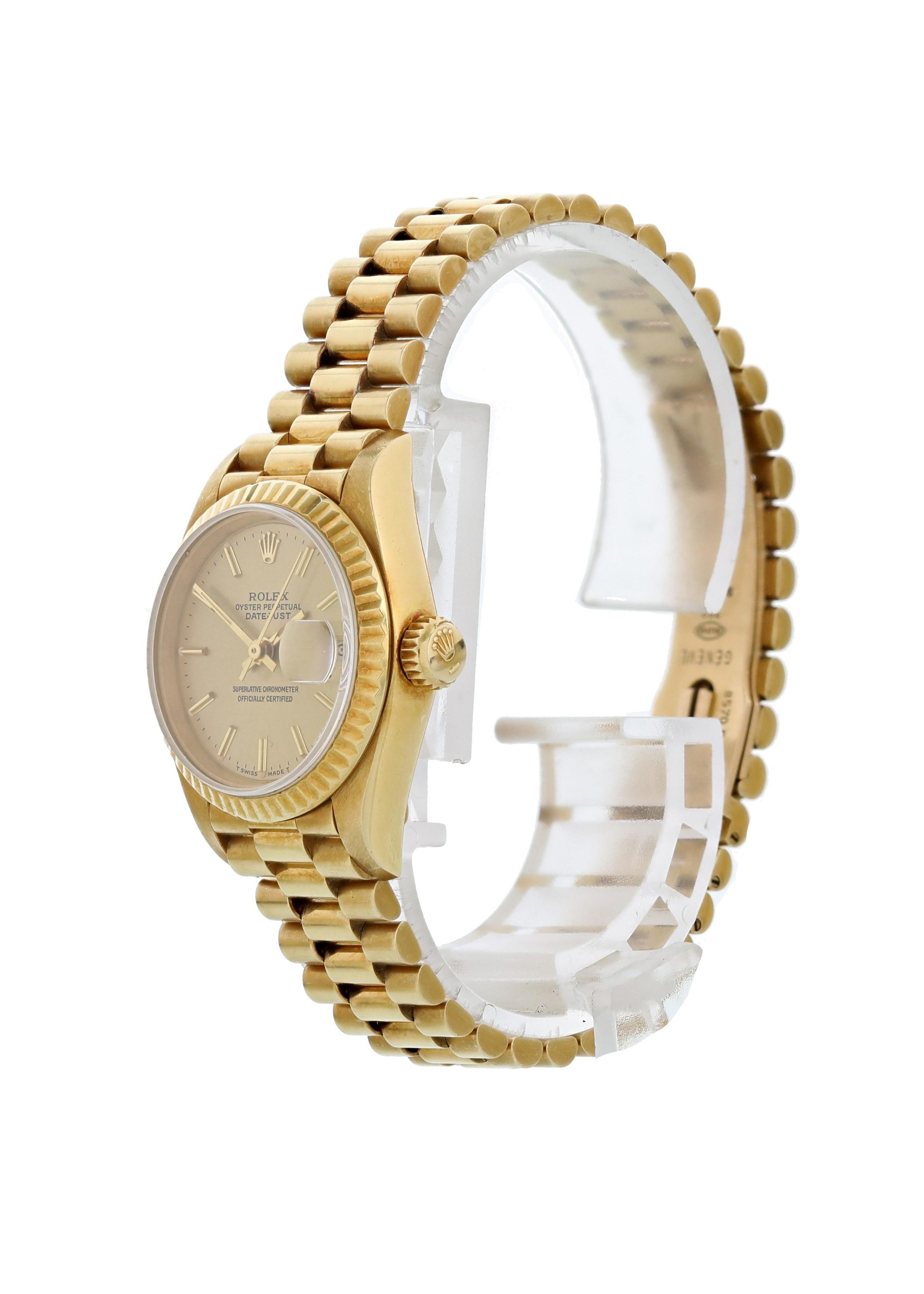 Rolex Datejust 69178 18K Yellow Gold Ladies Watch. 26mm 18K yellow gold case with a fluted bezel. Champagne dial with gold hands and gold tone indexes hour markers.  Quickset date display at 3 o'clock position. 18K yellow gold bracelet with 18K
