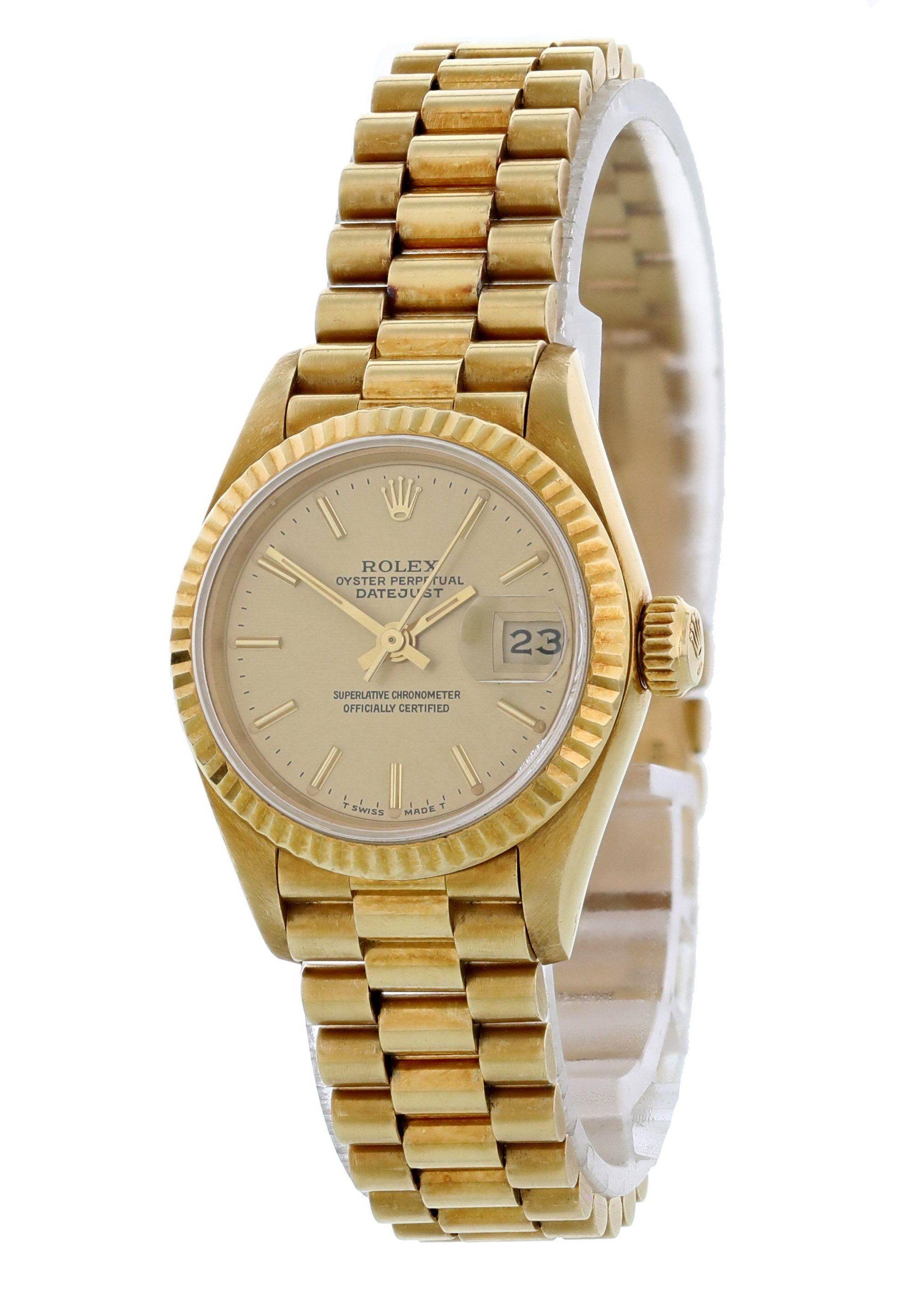 Rolex Datejust 69178 18K Yellow Gold Ladies Watch. 26mm 18K yellow gold case with a fluted bezel. Champagne dial with gold hands and gold tone indexes hour markers.  Quickset date display at 3 o'clock position. 18K yellow gold bracelet with 18K