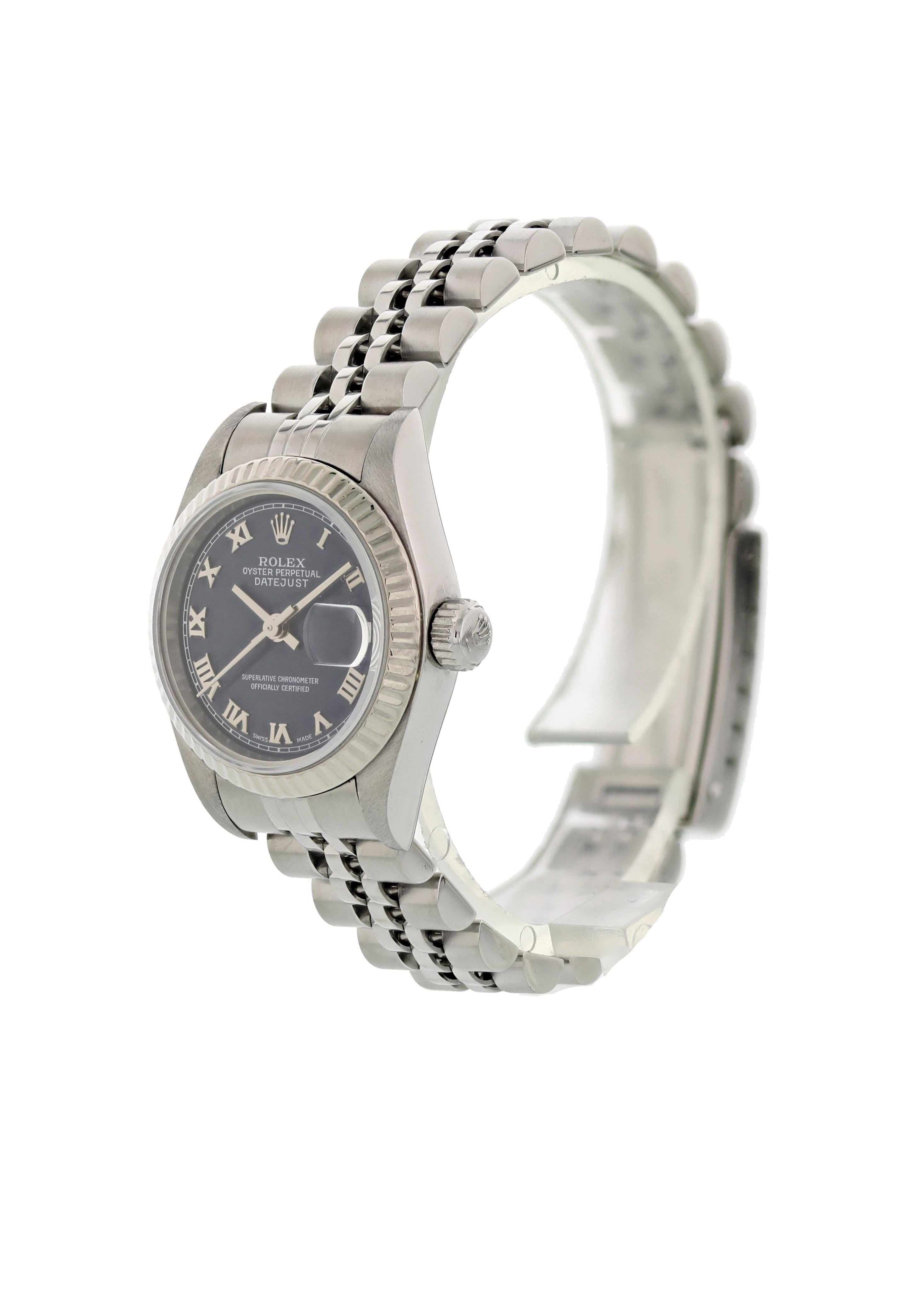 Rolex Oyster Perpetual Datejust 79174 Ladies Watch.  26mm Stainless steel case. 18K white gold fluted bezel. Blue dial with steel hands and Roman numeral markers. Quickset date display at the 3 o'clock position. Stainless steel jubilee bracelet with