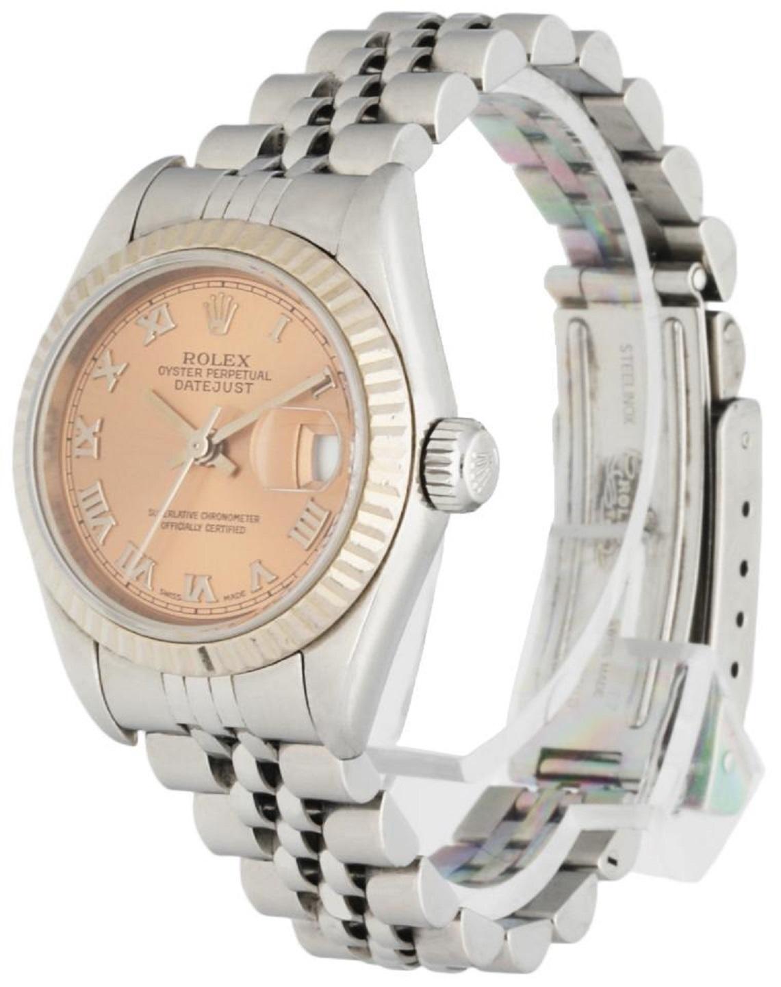 Rolex Oyster Perpetual Datejust 79174 Ladies Watch. Stainless steel 26mm case. 18k white gold fluted bezel. Pink dial with steel hands and markers. Date aperture. Stainless steel jubilee bracelet with folding clasp, will fit up to a 5.75 inch wrist.