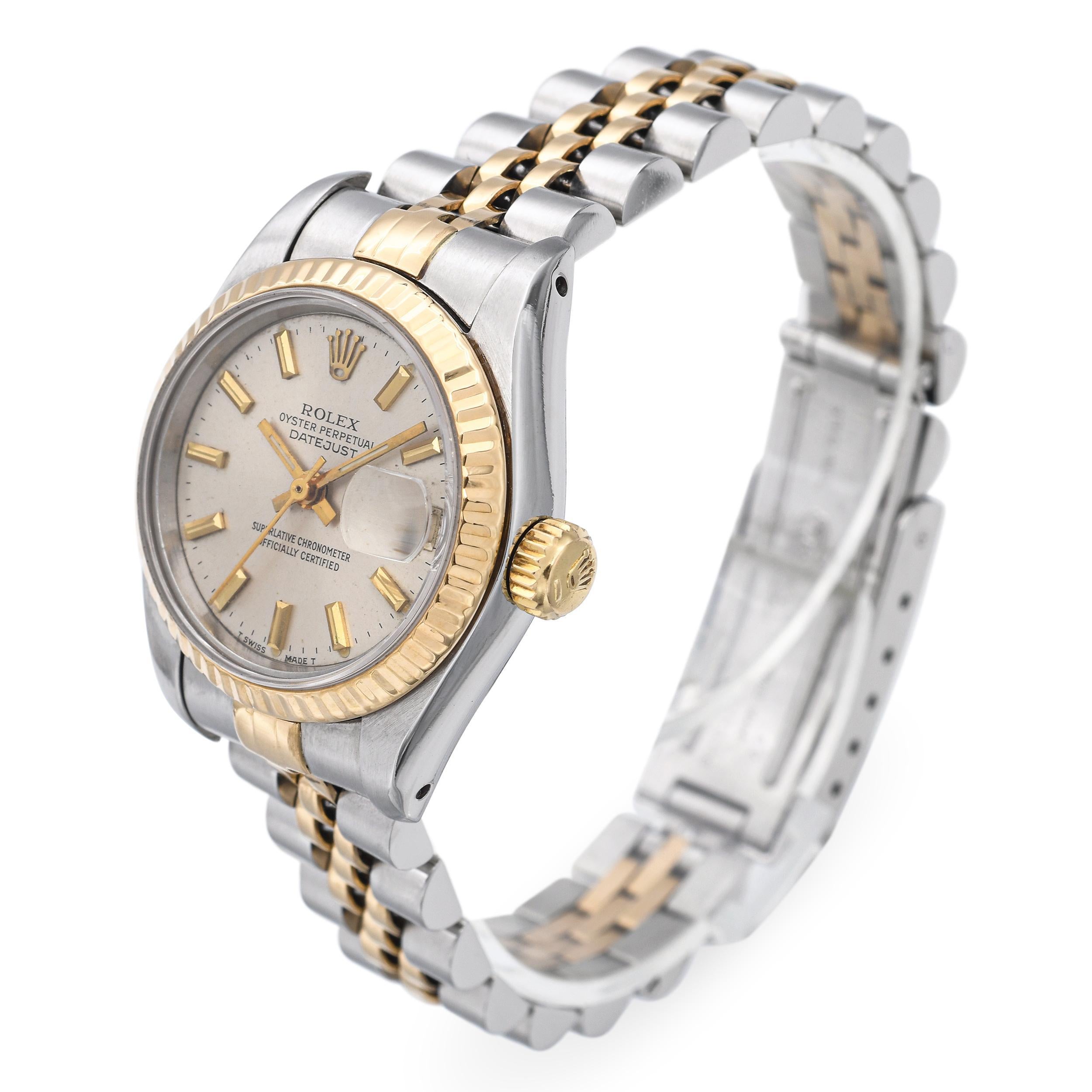 A timeless symbol of refinement and performance, this Rolex Oyster Perpetual Datejust women's watch seamlessly blends iconic design with precision engineering. Crafted from durable stainless steel and accented with a yellow gold fluted bezel and