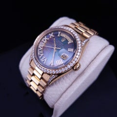 Rolex Oyster Perpetual Day Date en or jaune 18KY Black Mather of Pearl Diamant