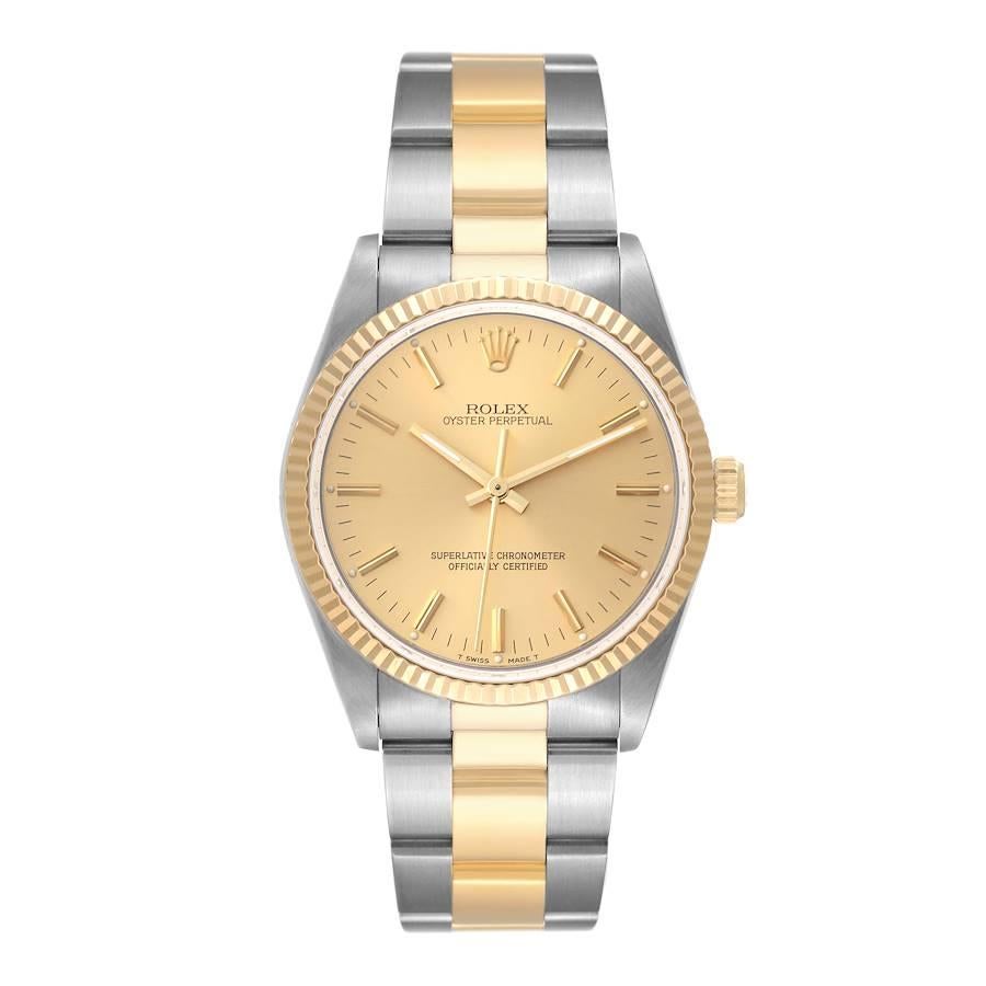 Rolex Oyster Perpetual Fluted Bezel Steel Yellow Gold Mens Watch 14233. Officially certified chronometer automatic self-winding movement. Stainless steel and 18K yellow gold oyster case 34.0 mm in diameter. Rolex logo on the crown. 18K yellow gold