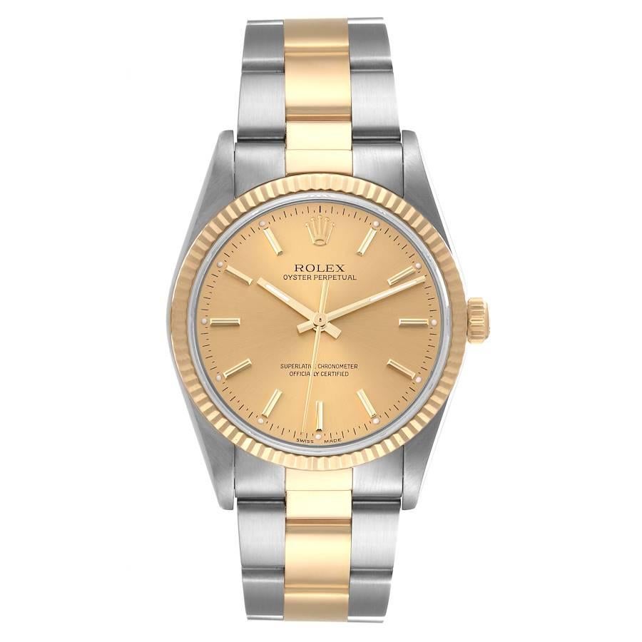 Rolex Oyster Perpetual Fluted Bezel Steel Yellow Gold Mens Watch 14233. Officially certified chronometer automatic self-winding movement. Stainless steel and 18K yellow gold oyster case 34.0 mm in diameter. Rolex logo on the crown. 18K yellow gold