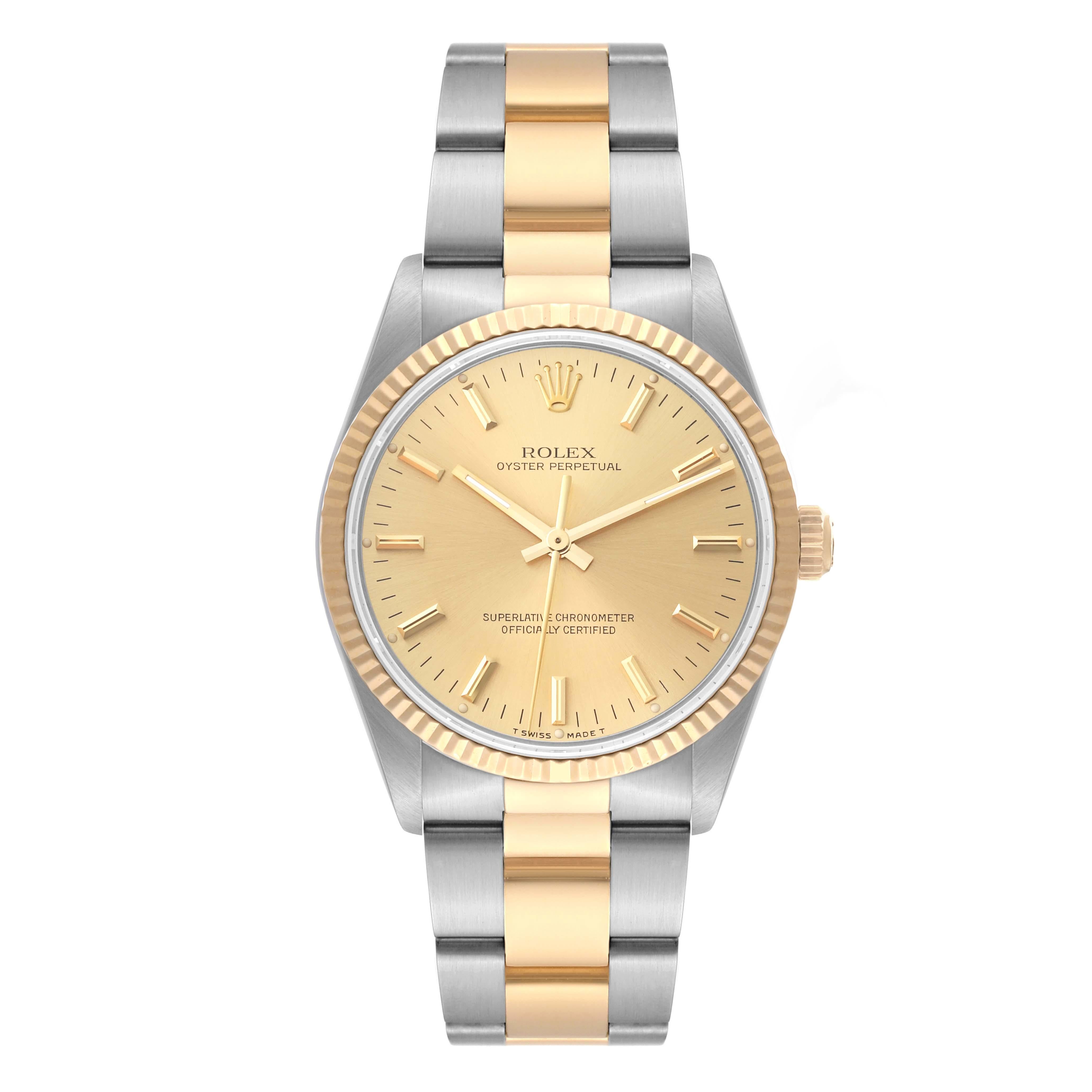 Rolex Oyster Perpetual Fluted Bezel Steel Yellow Gold Mens Watch 14233. Officially certified chronometer automatic self-winding movement. Stainless steel and 18K yellow gold oyster case 34.0 mm in diameter. Rolex logo on the crown. 18K yellow gold
