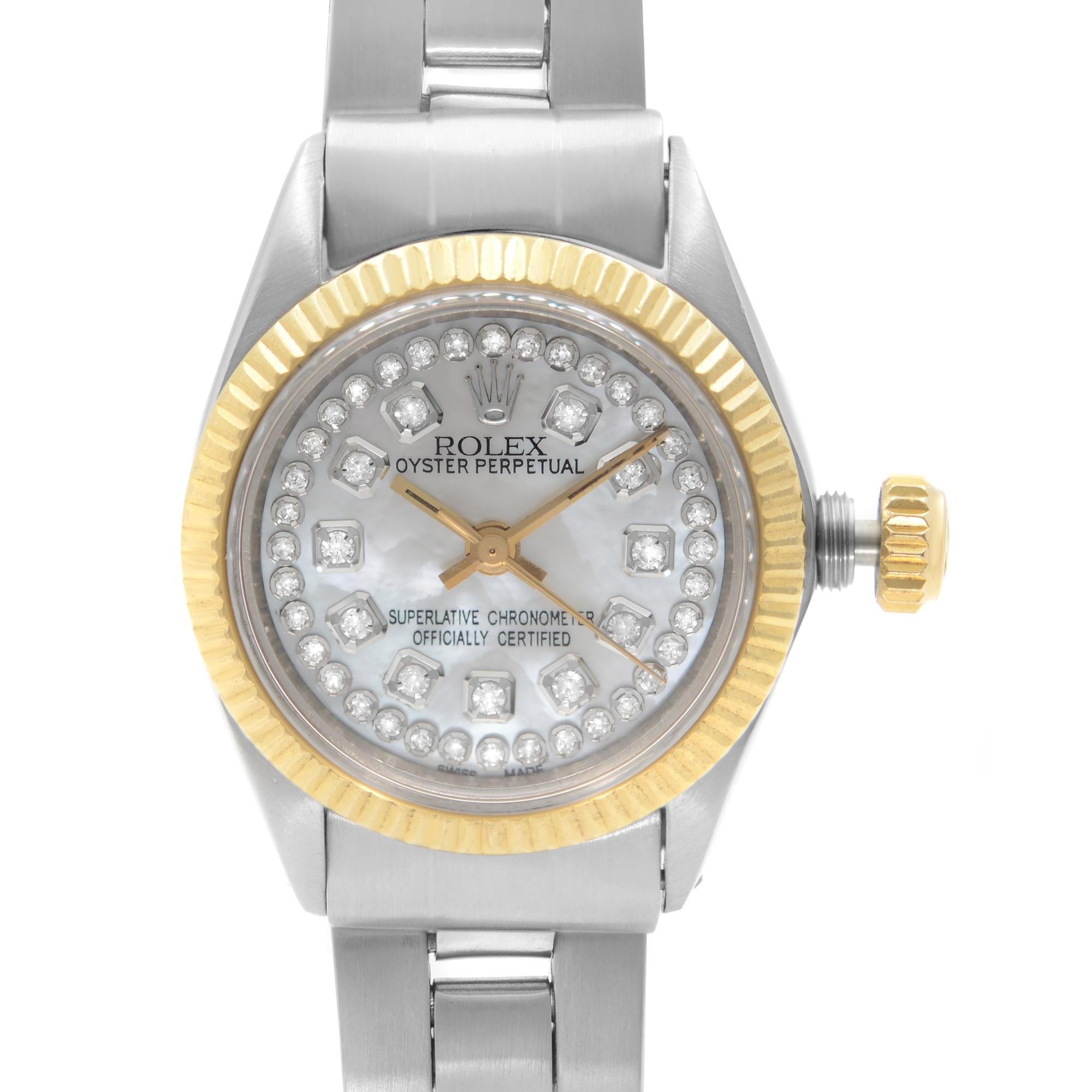 Pre-owned Vintage Rolex Oyster Perpetual Gold Stainless Steel Diamond Mother of Pearl Dial Ladies Watch 6719. It Was Produced in 1973. This Beautiful Timepiece Features: Stainless Steel Case with a Stainless Steel Bracelet, a Fixed Yellow Gold