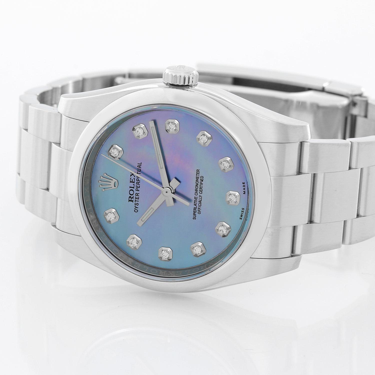 Rolex Oyster Perpetual Men's Stainless Steel Watch 116000 -  Automatic winding, 31 jewels, sapphire crystal. Stainless steel case with smooth bezel (36mm diameter). Custom Blue Mother of Pearl dial with diamond hour markers. Stainless steel Oyster