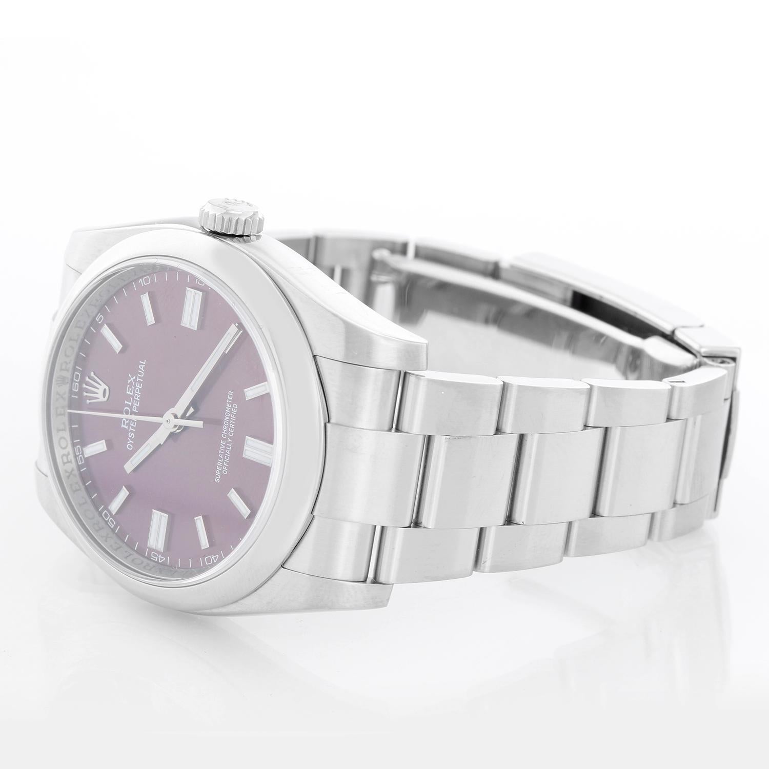 Rolex Oyster Perpetual Men's Stainless Steel Watch 116000 - Automatic winding, 31 jewels, sapphire crystal. Stainless steel case with smooth bezel (36mm diameter). Grape dial with luminous hour markers. Stainless steel Oyster bracelet. Pre-owned