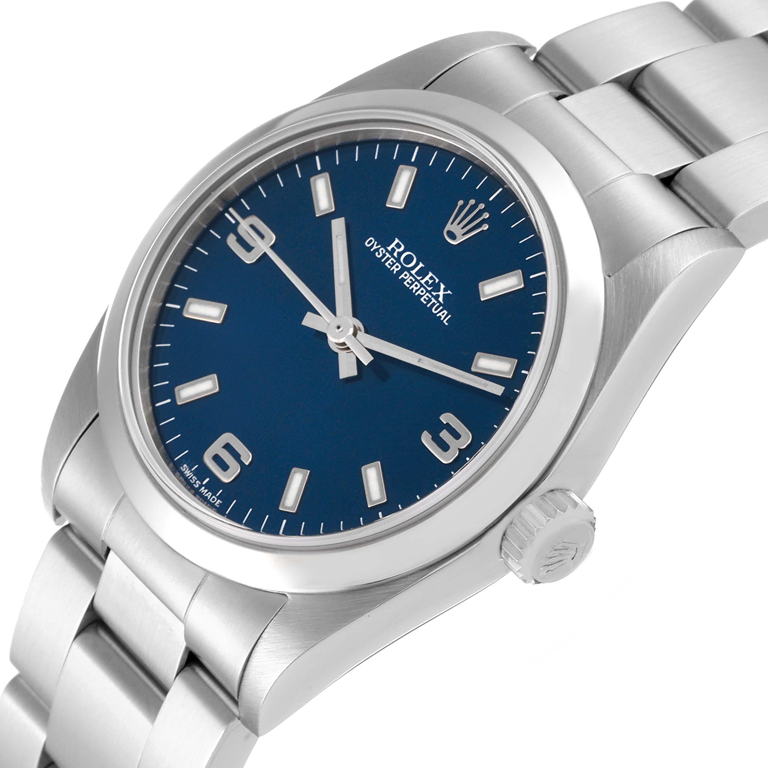 Rolex Oyster Perpetual Midsize 31 Blue Dial Steel Ladies Watch 77080 Box Papers. Officially certified chronometer automatic self-winding movement. Stainless steel oyster case 31 mm in diameter. Rolex logo on the crown. Stainless steel smooth bezel.