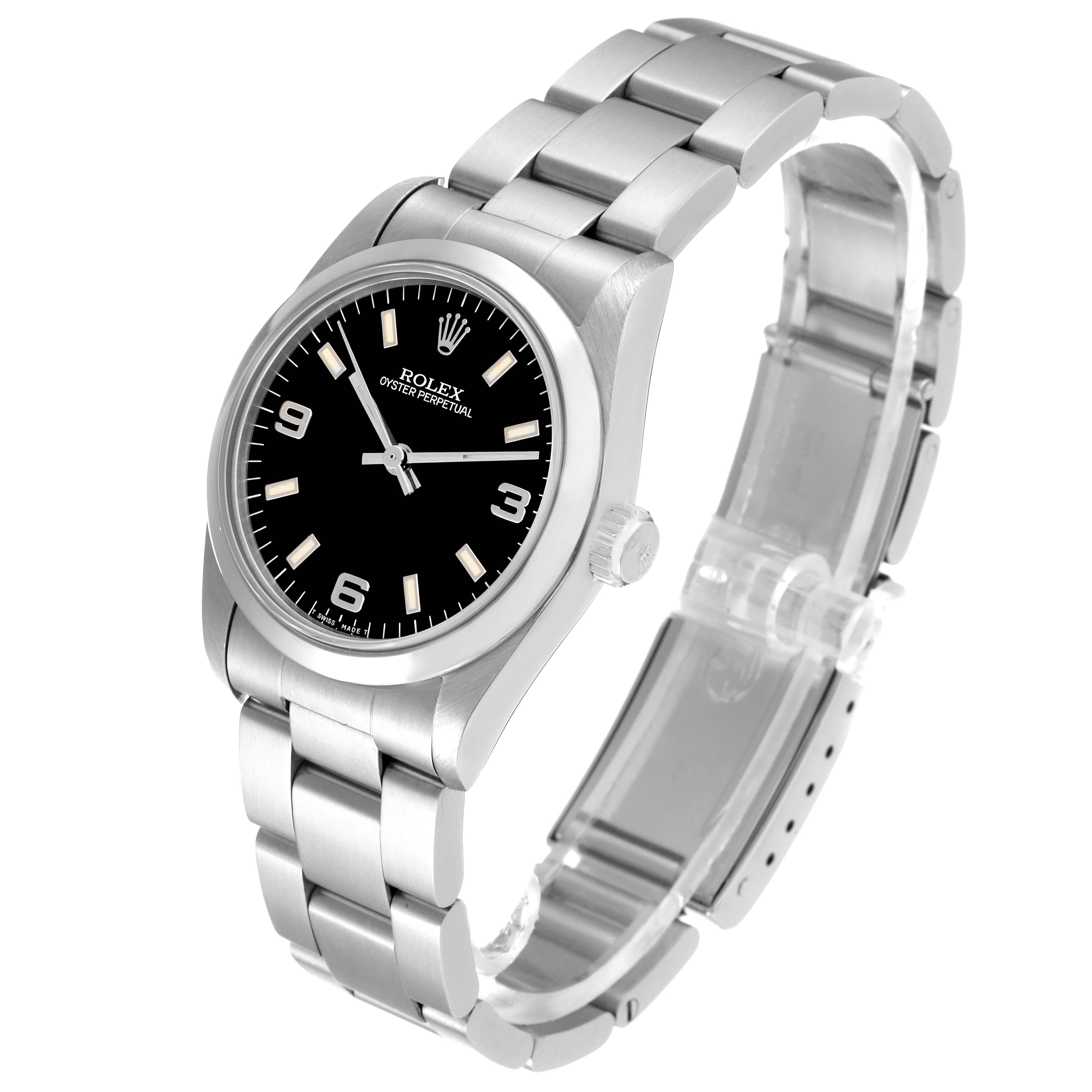 Rolex Oyster Perpetual Midsize Black Dial Steel Ladies Watch 67480. Automatic self-winding movement. Stainless steel oyster case 31.0 mm in diameter. Rolex logo on a crown. Stainless steel smooth bezel. Scratch resistant sapphire crystal. Black dial