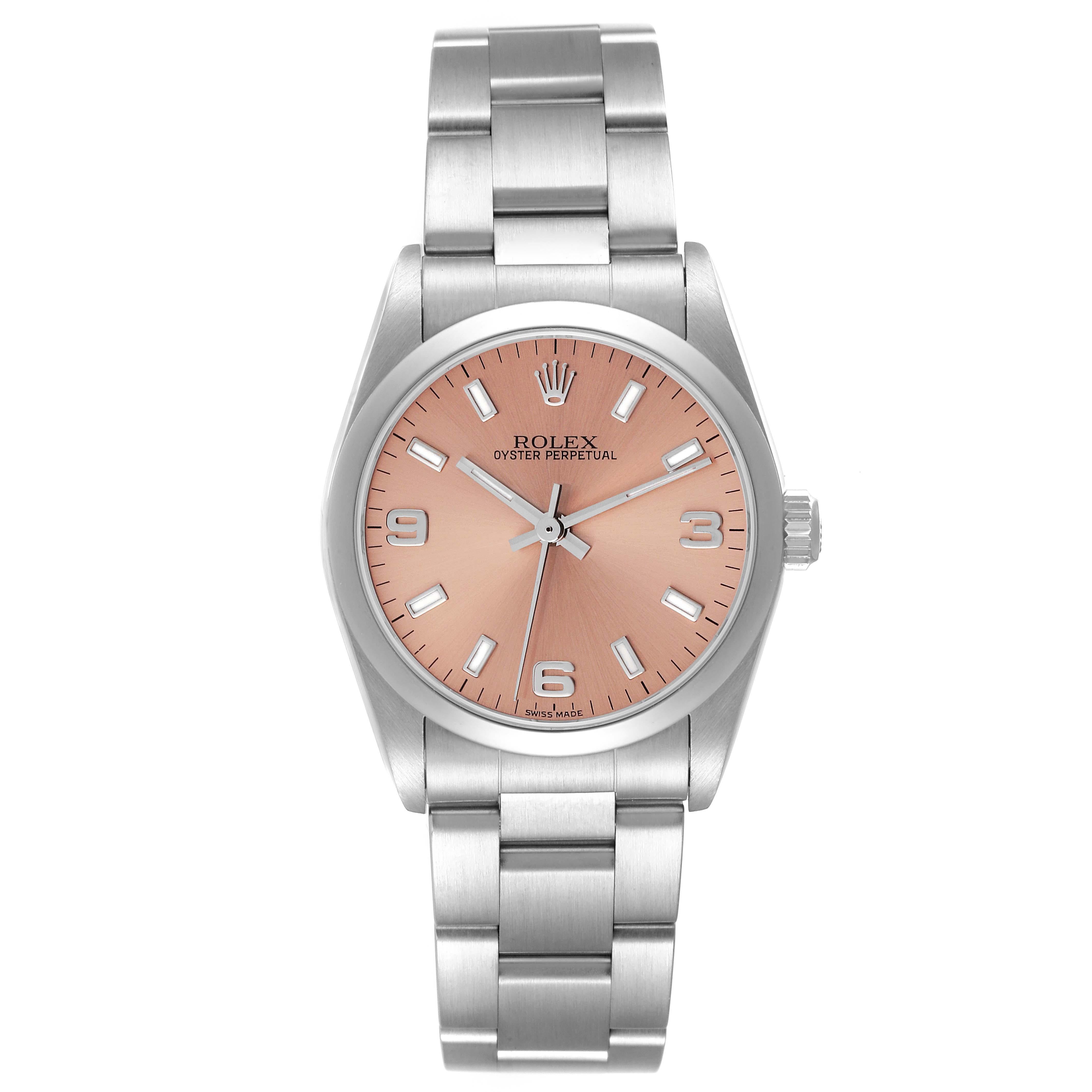 Rolex Oyster Perpetual Midsize Salmon Dial Steel Ladies Watch 77080. Officially certified chronometer automatic self-winding movement. Stainless steel oyster case 31.0 mm in diameter. Rolex logo on the crown. Stainless steel smooth bezel. Scratch