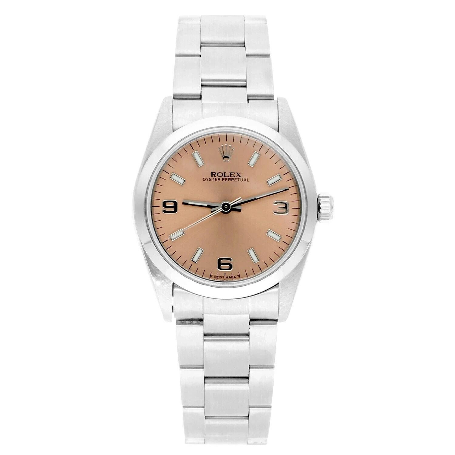 Rolex Oyster Perpetual Midsize Salmon Dial Steel Ladies Watch 77080, Circa 1999 A series.
This watch has been professionally polished, serviced and is in excellent overall condition. There are absolutely no visible scratches or blemishes.
