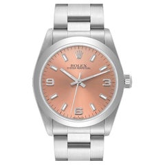 Rolex Montre Oyster Perpetual en acier avec lunette fumée et cadran saumon, taille moyenne, pour femmes 77080