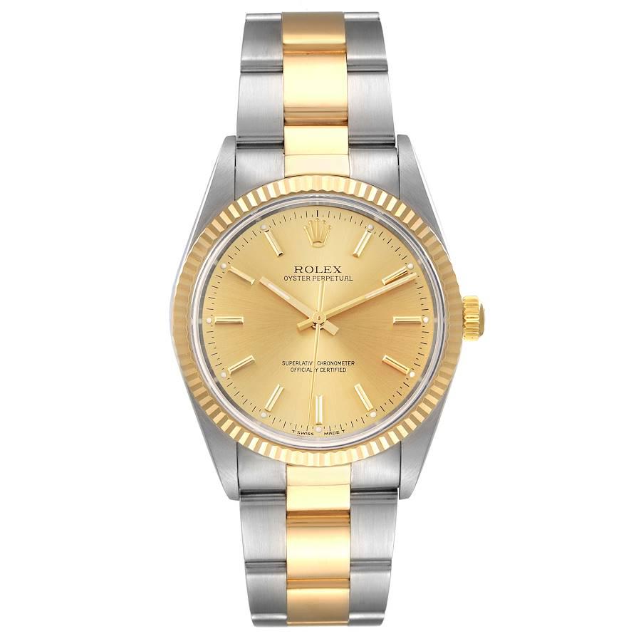 Rolex Oyster Perpetual NonDate Steel 18k Yellow Gold Mens Watch 14233. Officially certified chronometer self-winding movement. Stainless steel and 18K yellow gold oyster case 34.0 mm in diameter. Rolex logo on a crown. 18K yellow gold fluted bezel.