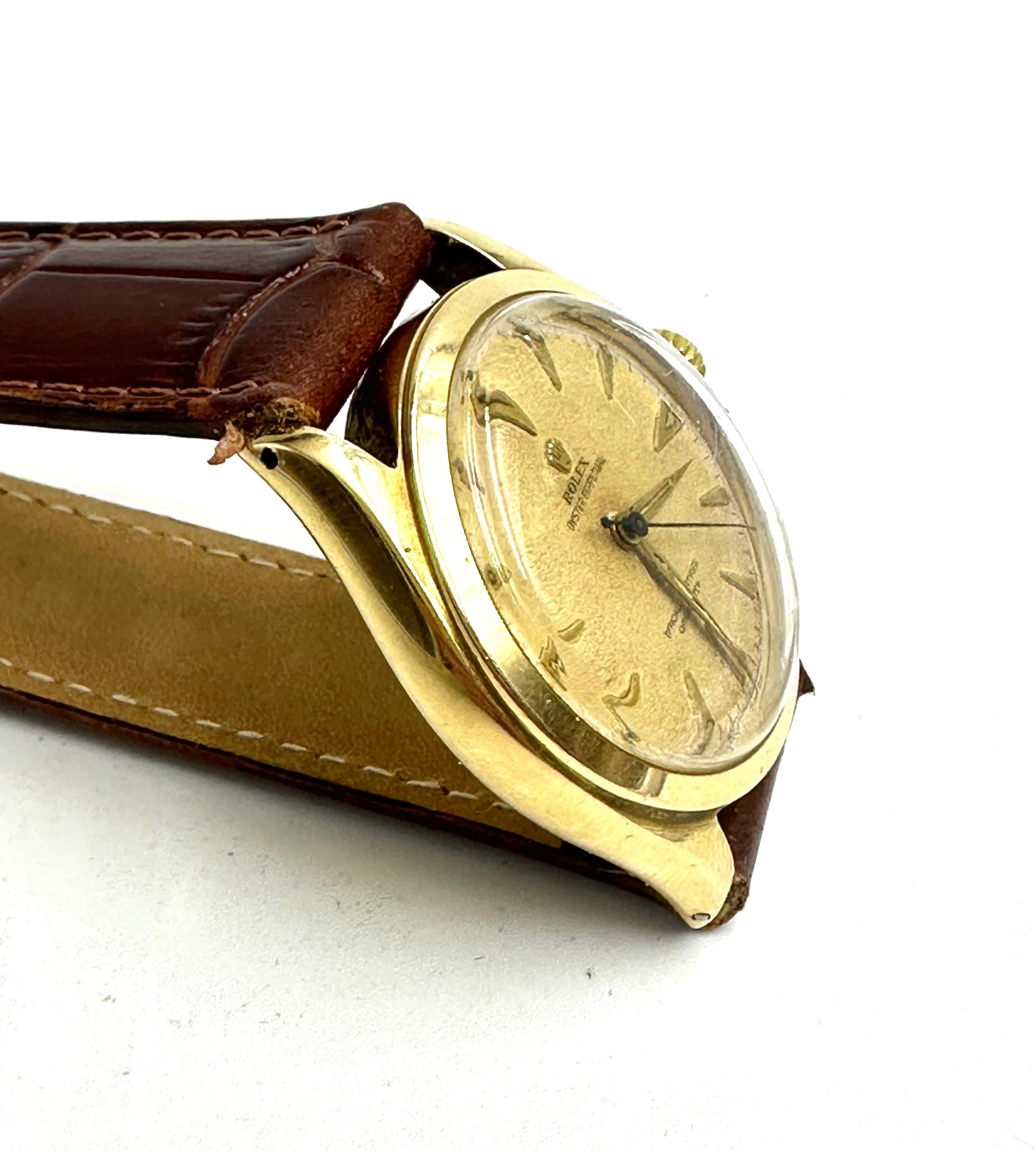 Check out this stunning Rolex Oyster Perpetual, Ref 6084 with a 14K gold case. 
100% genuine and all original, fully inspected, serviced, and guaranteed. 
This carefully owned and completely original example is a Swiss hallmarked 14ct solid yellow