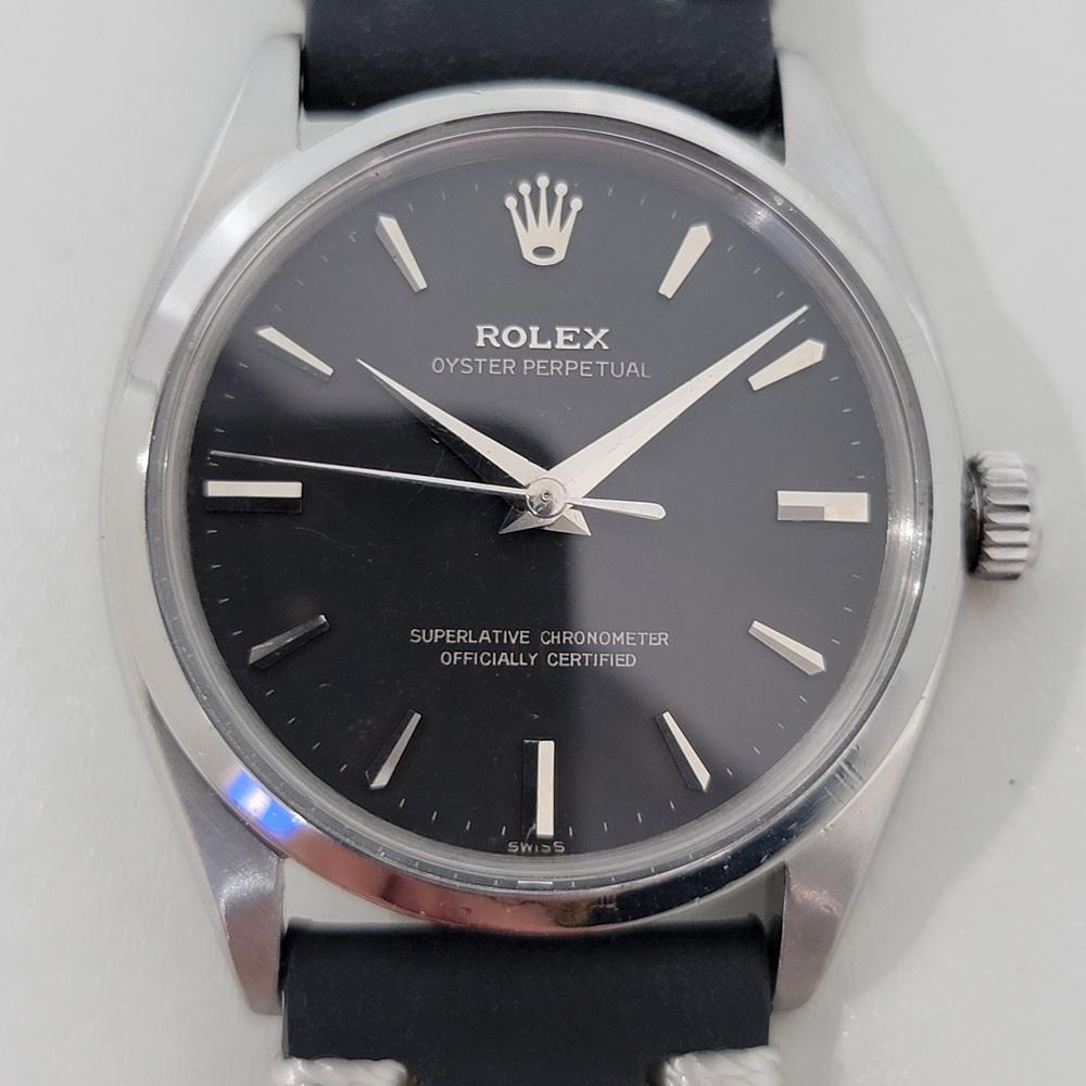 Timeless classic, Men's rare Rolex Oyster Perpetual 6564 automatic dress watch, c.1959, in excellent working condition. Verified authentic by a master watchmaker. Gorgeous Rolex signed black dial, applied baton and broadsword index hour markers,