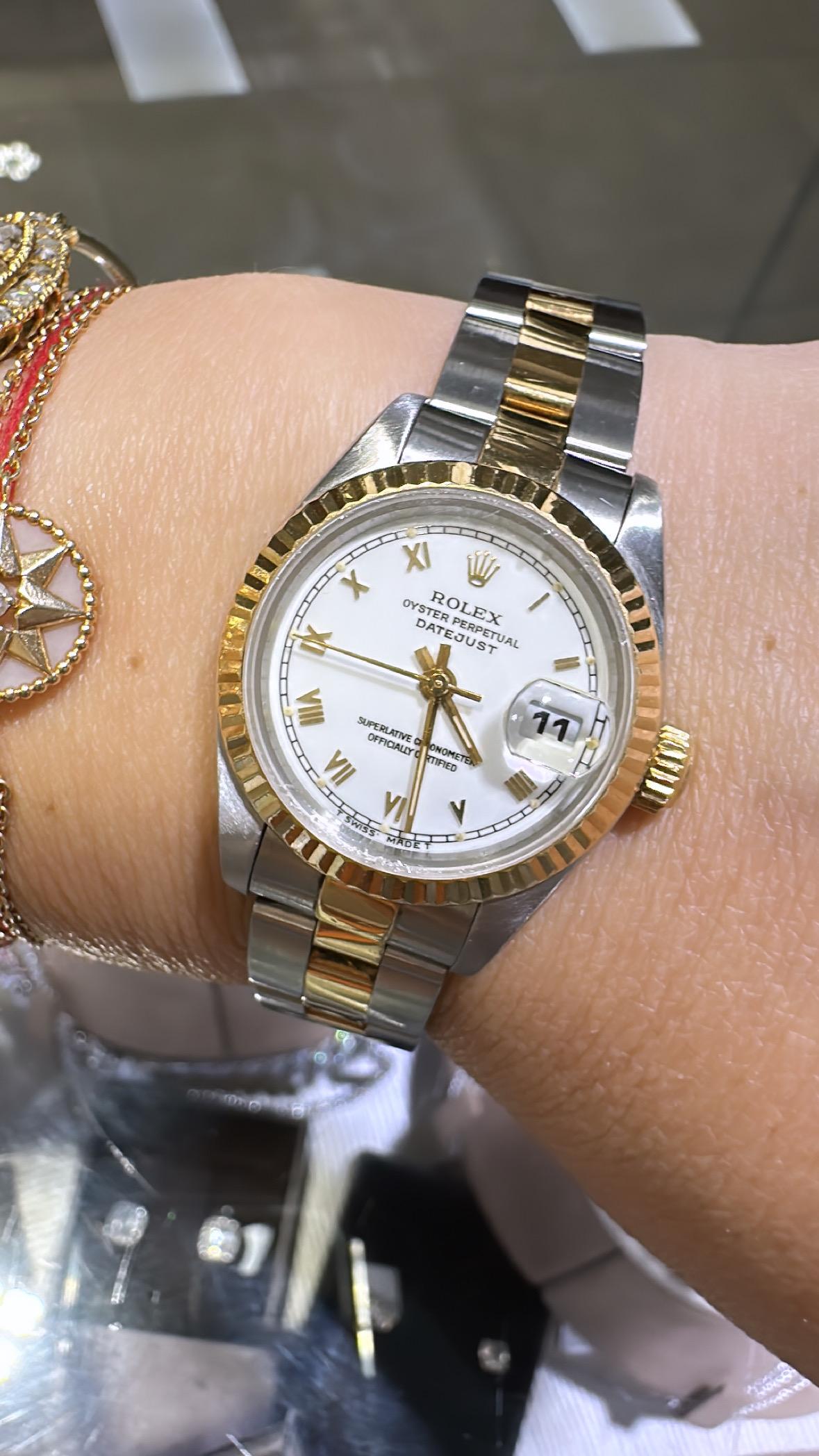 Rolex Oyster Perpetual Automatic Woman's Watch on Original Bracelet

Specs:

Serial: SHT143384

* 26 mm

* Automatic movement 

Ref: 69173

Includes: Watch with Rolex Two Tone 18K Yellow Gold & Stainless steel 