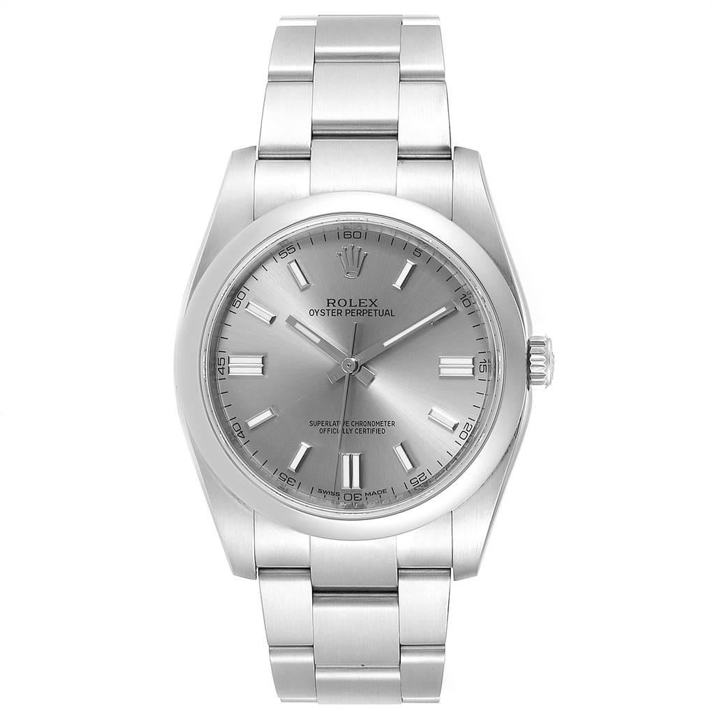 Rolex Oyster Perpetual Rhodium Dial Steel Mens Watch 116000 Box. Officially certified chronometer self-winding movement. Stainless steel case 36.0 mm in diameter. Rolex logo on a crown. Stainless steel smooth domed bezel. Scratch resistant sapphire