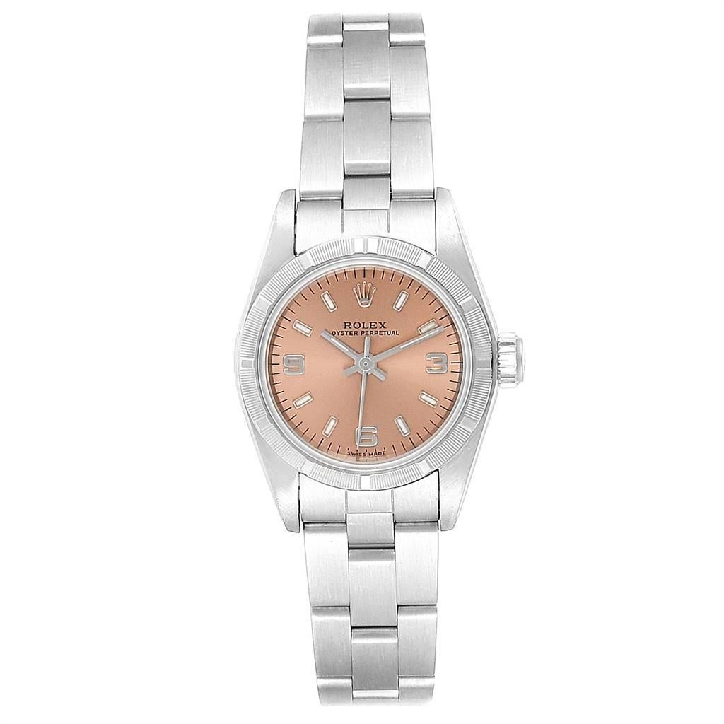 Rolex Oyster Perpetual Salmon Dial Oyster Bracelet Ladies Watch 67230. Officially certified chronometer self-winding movement. Stainless steel oyster case 24.0 mm in diameter. Rolex logo on a crown. Stainless steel engine turned bezel. Scratch